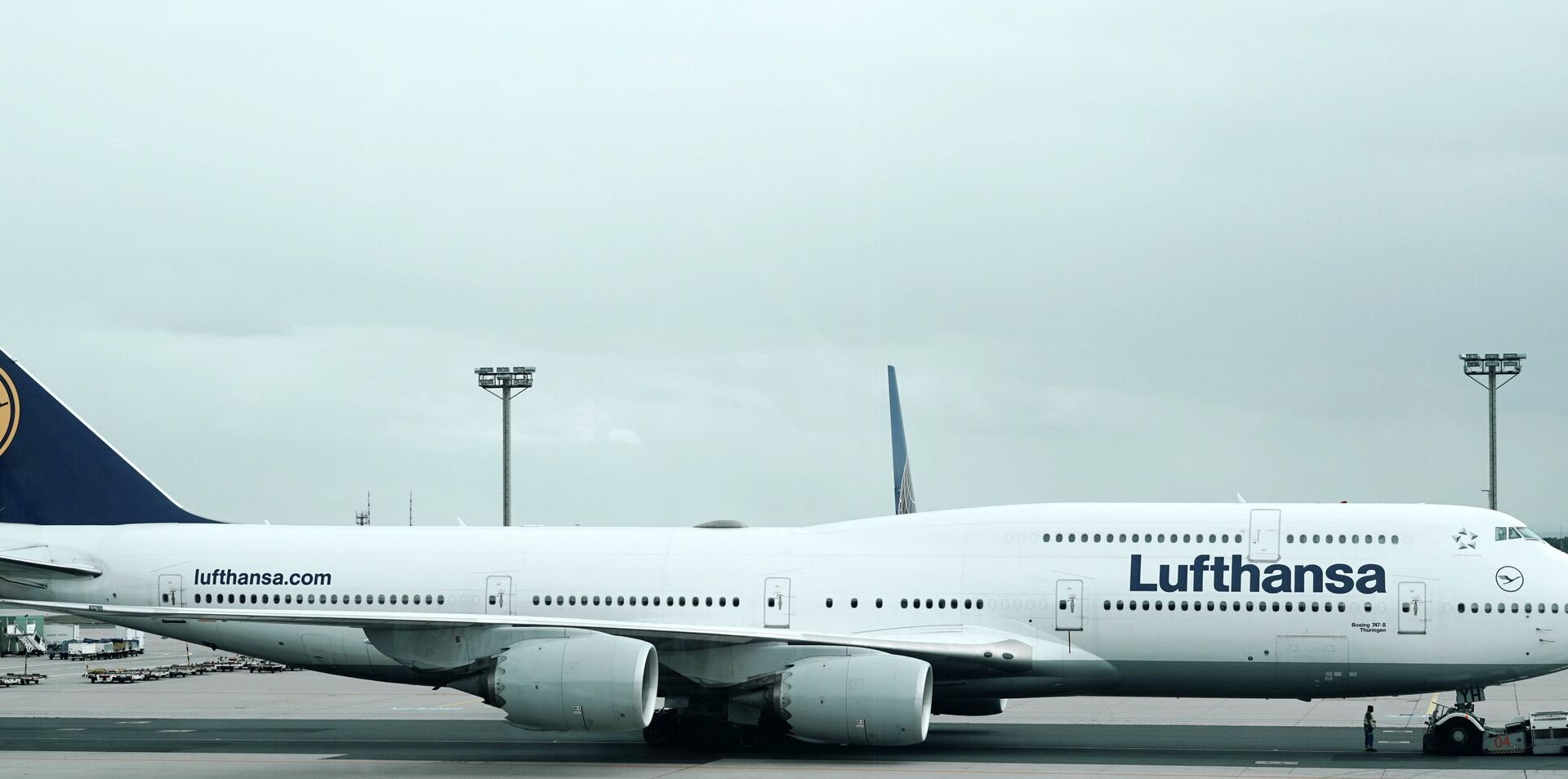 a large white airplane on a runway