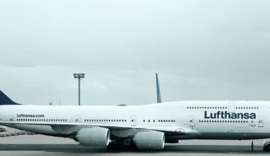 a large white airplane on a runway