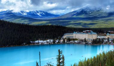 a large building next to a lake