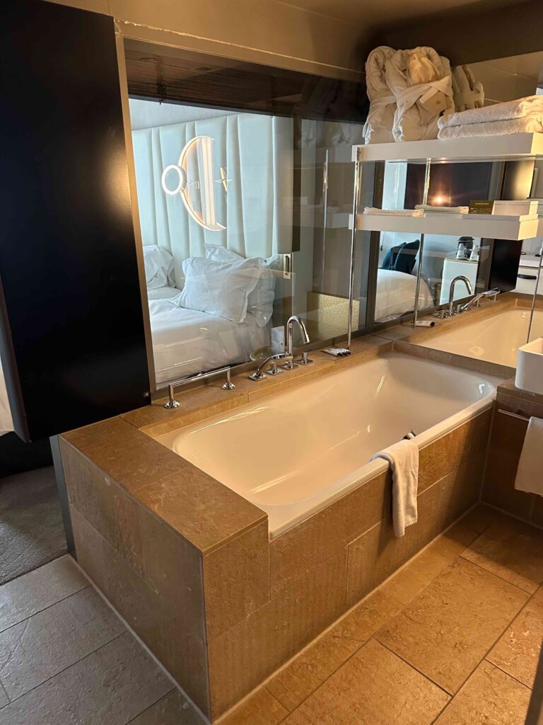 a bathroom with a bathtub and a mirror