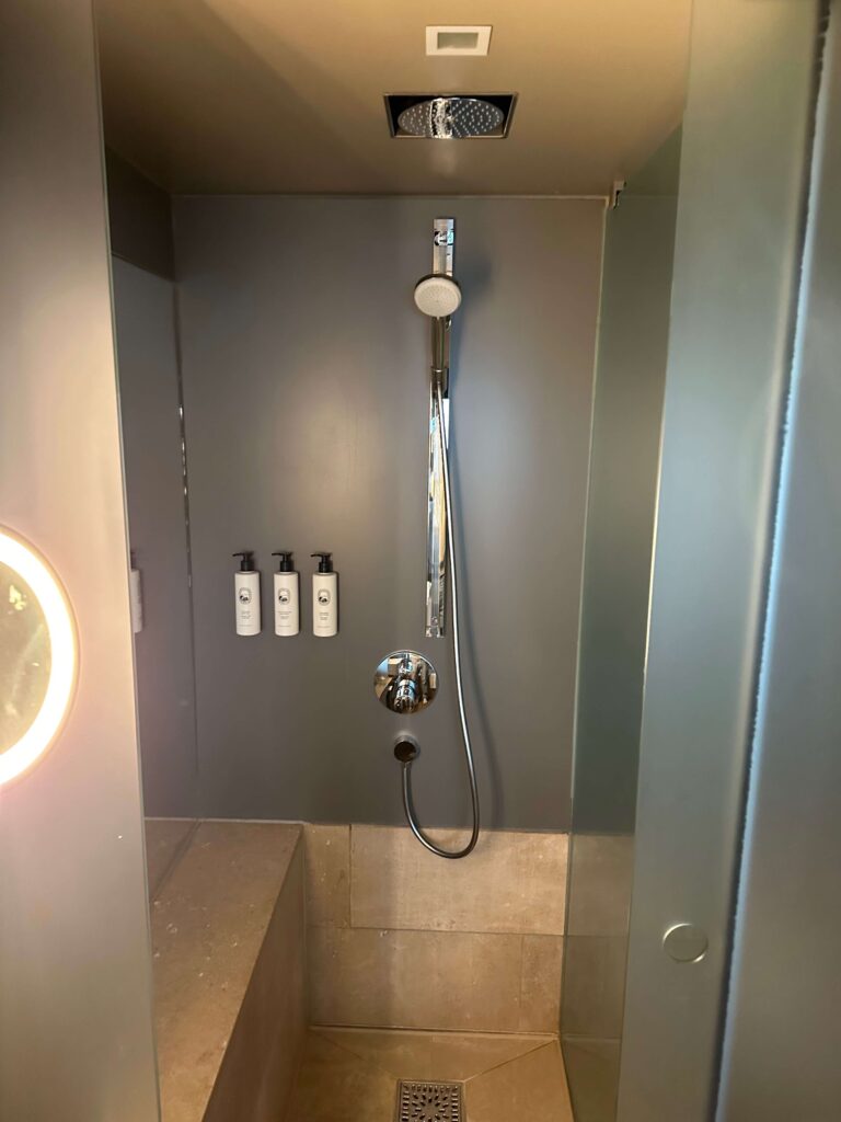a shower with a round light