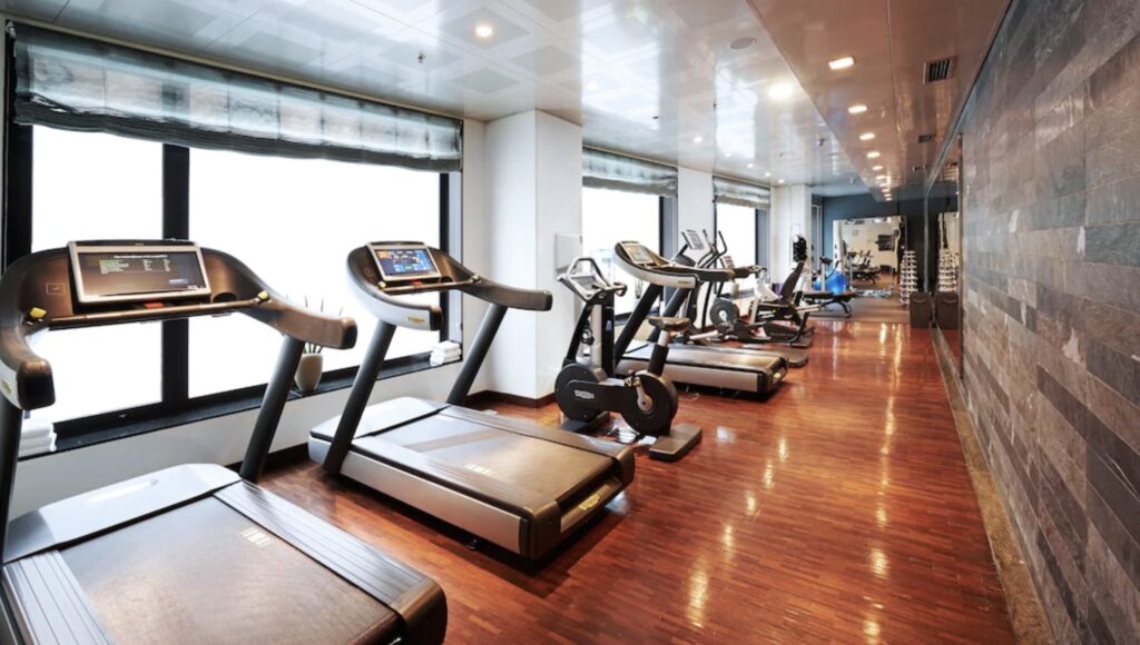 a room with treadmills and exercise equipment