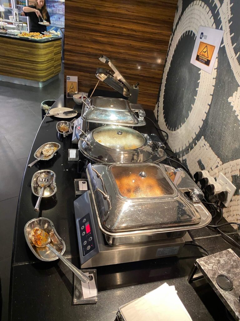 a buffet line with food on it