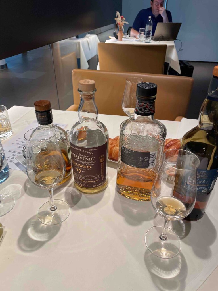 a group of bottles and glasses on a table