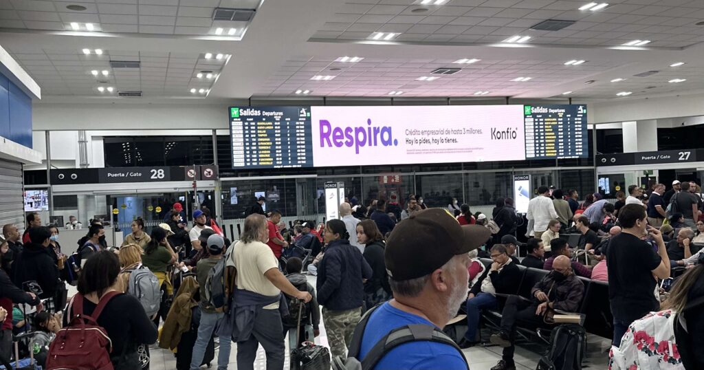 a group of people in a terminal