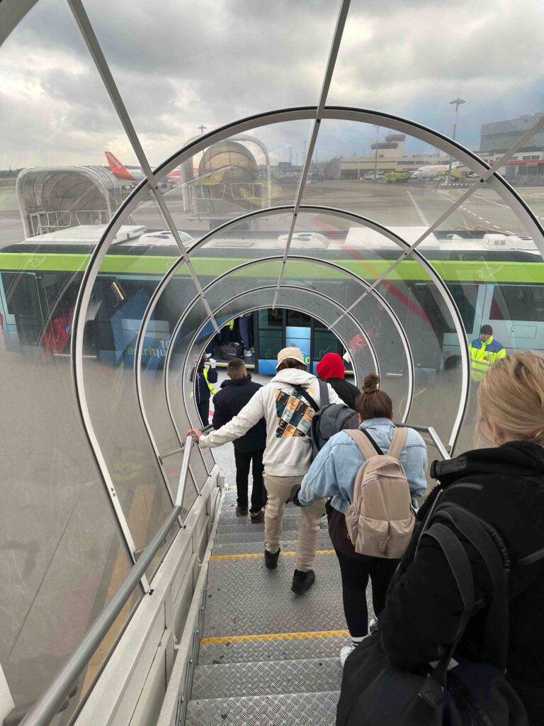 a group of people walking up a staircase