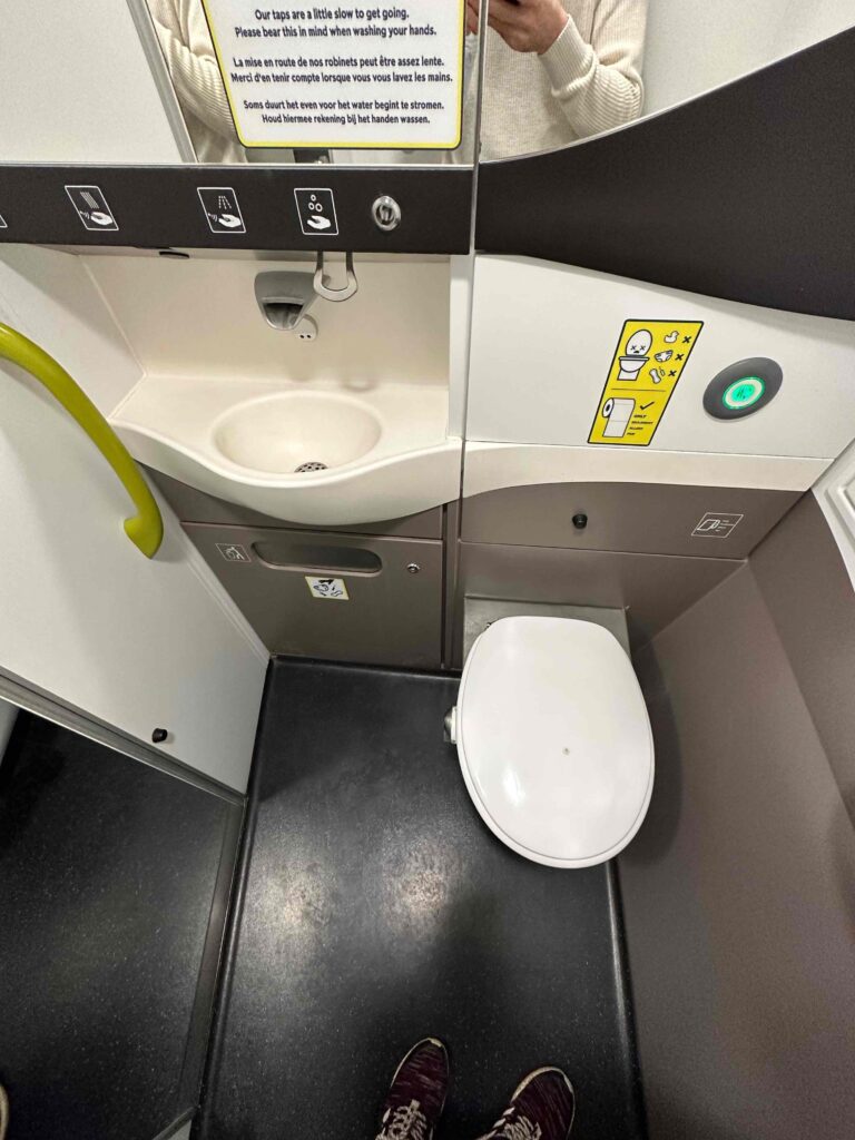 a toilet and sink in a bathroom