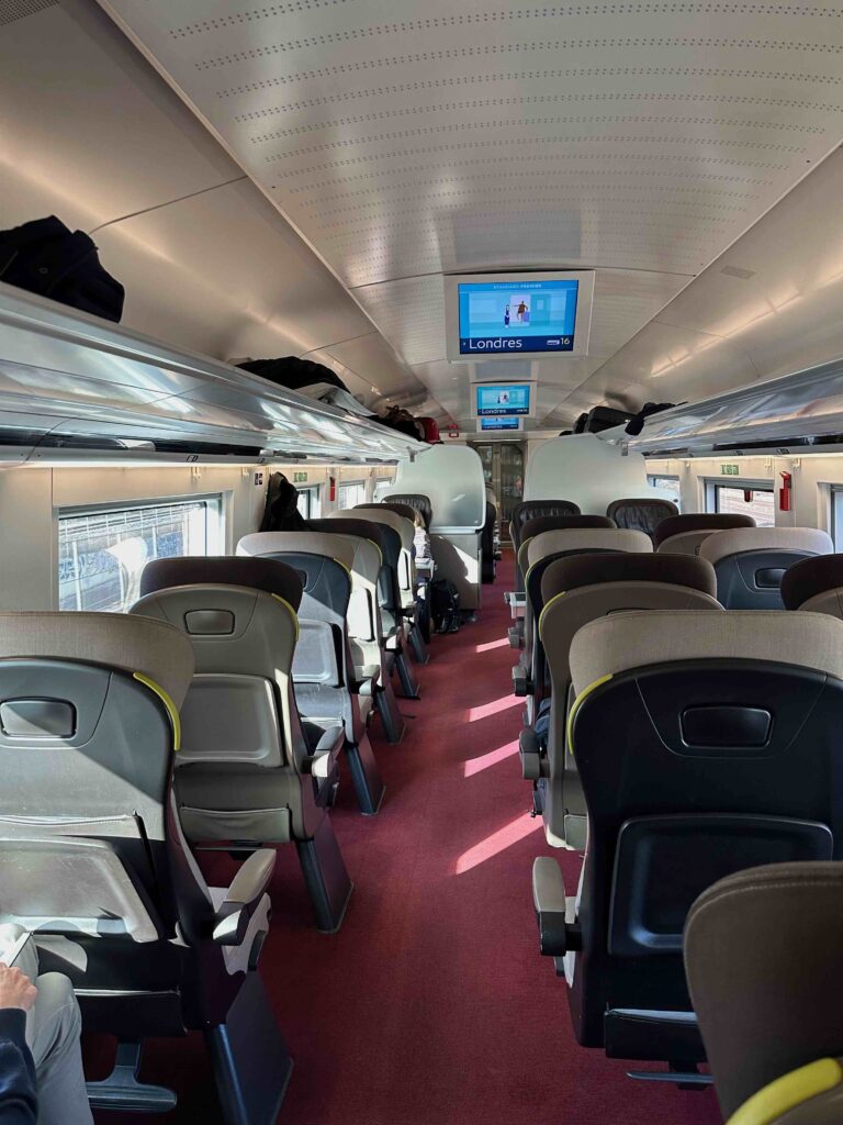 a train with seats and a screen