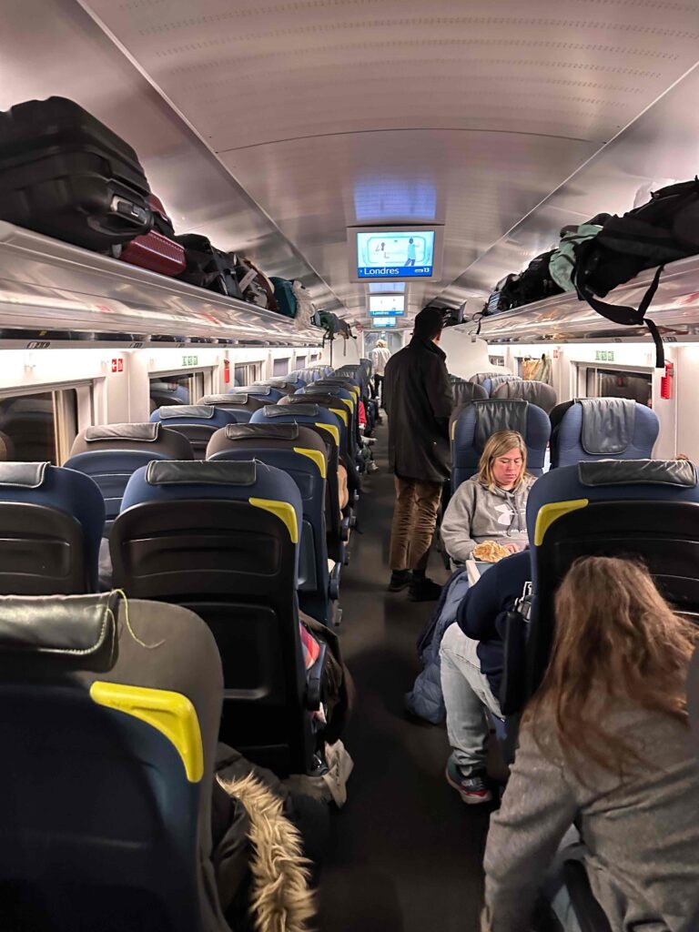 a group of people sitting on a train