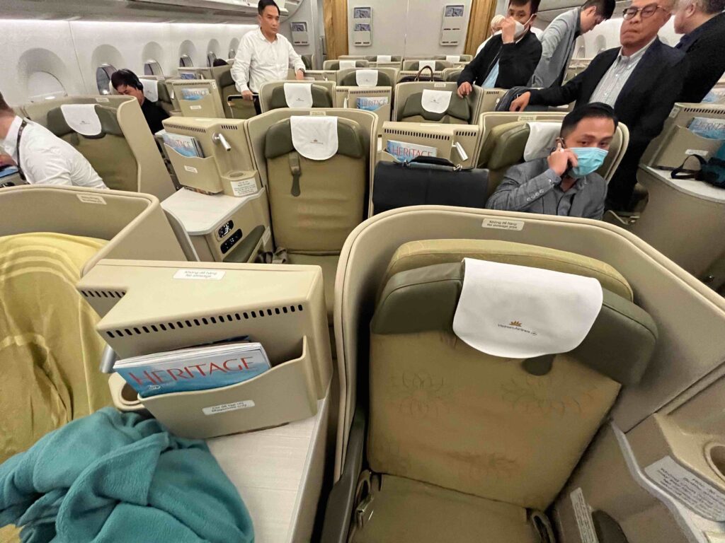 a group of people sitting in an airplane