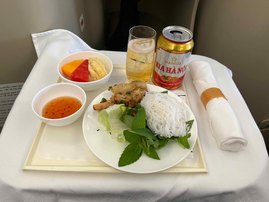 a plate of food and drinks on a tray