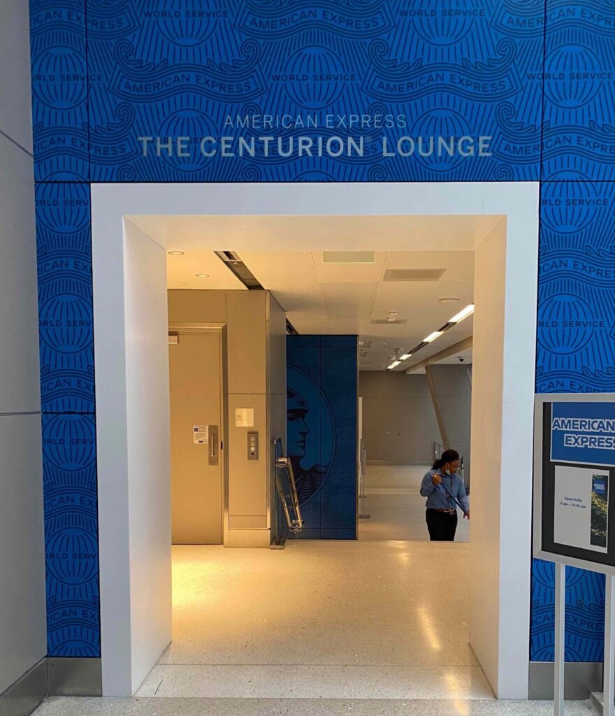 a blue and white doorway with a sign on the wall