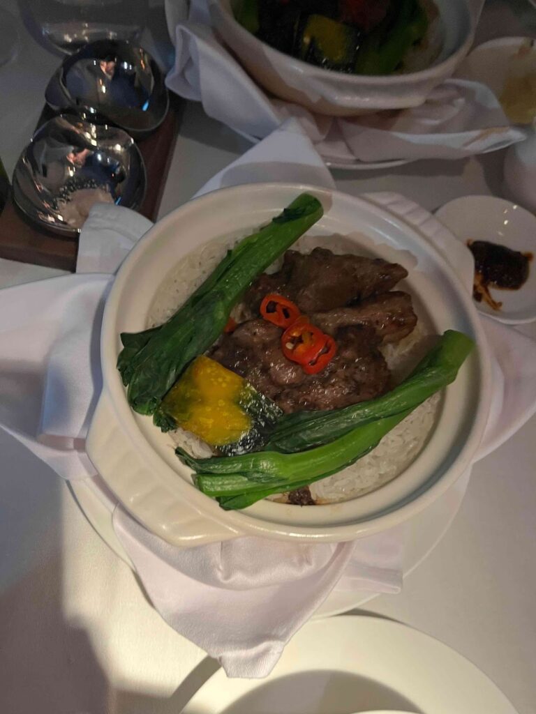 a bowl of food with vegetables on it