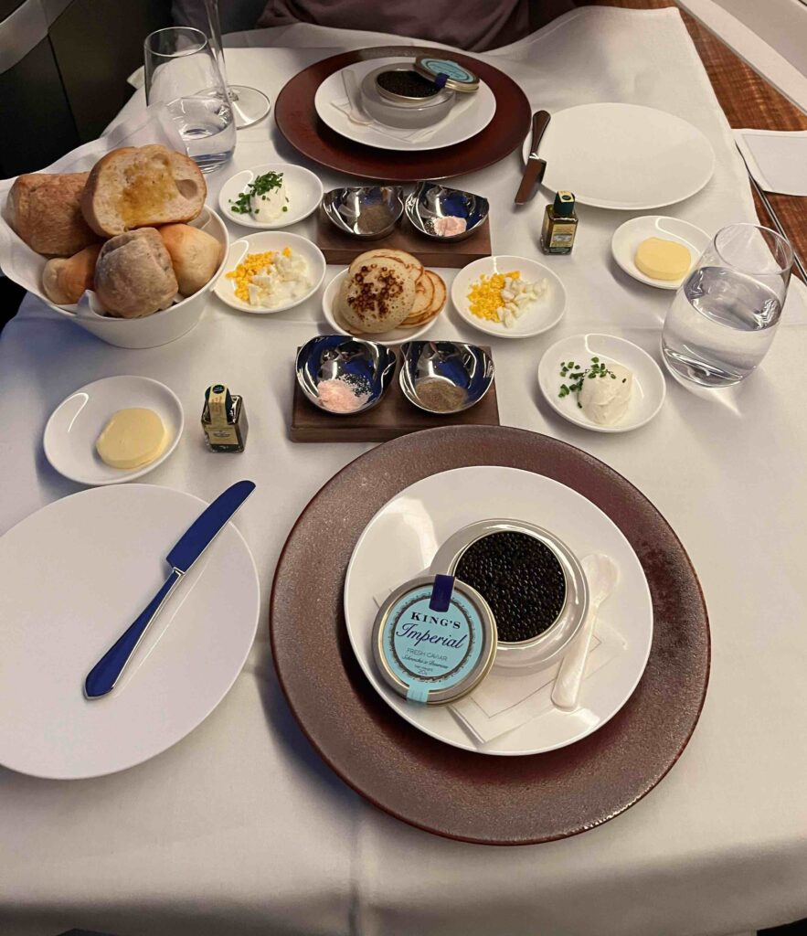 a table with plates and bowls of food