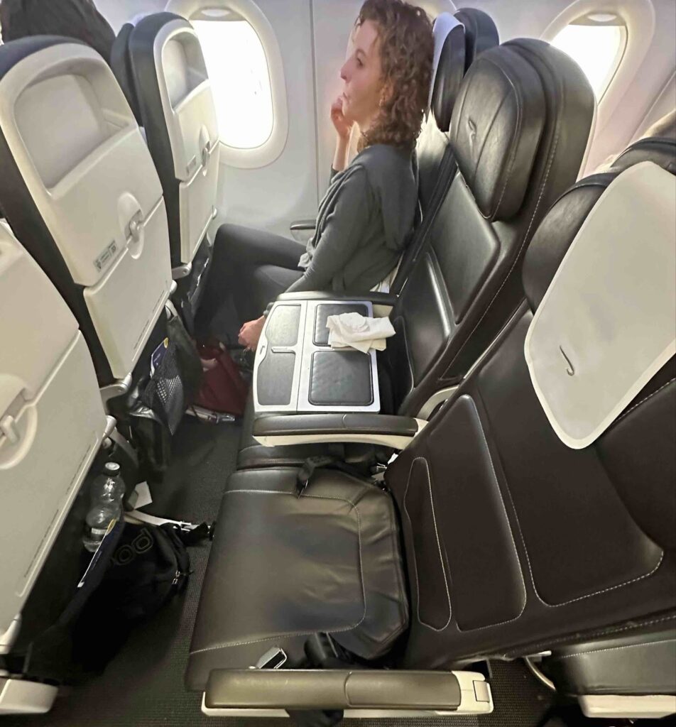 a woman sitting in an airplane