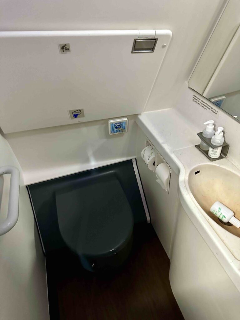 a toilet and sink in a bathroom