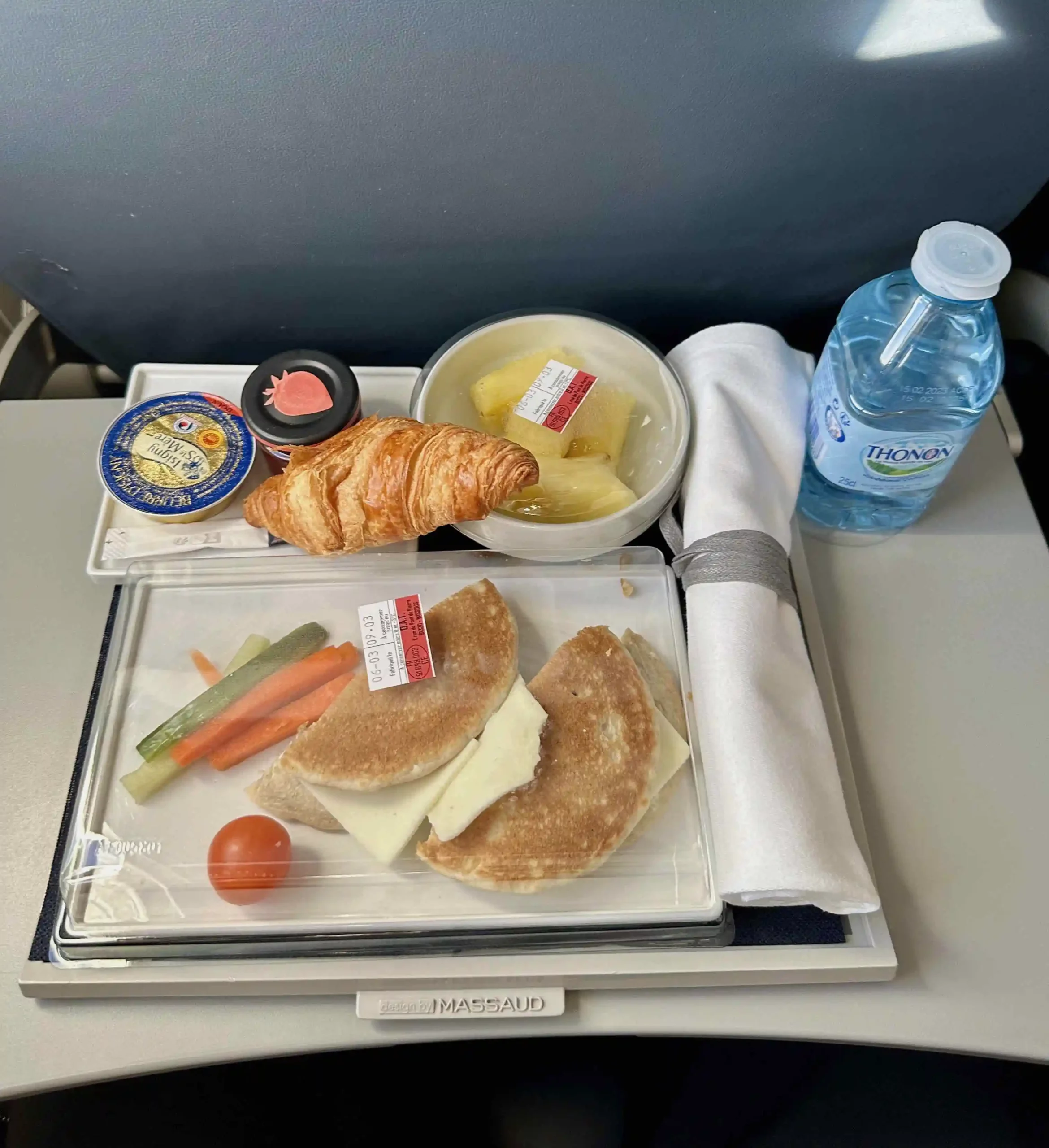 food on a tray on a plane