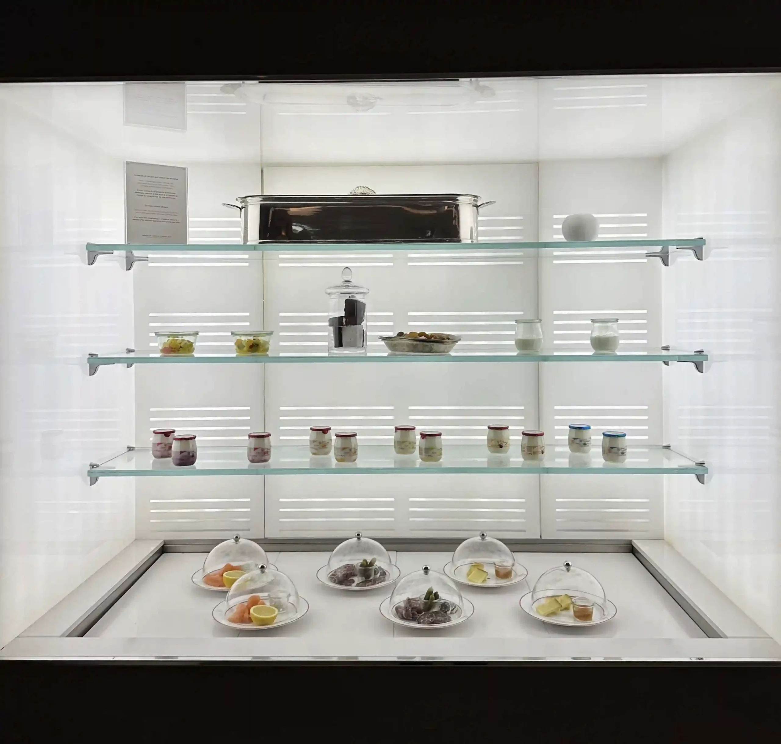 a display case with food on shelves