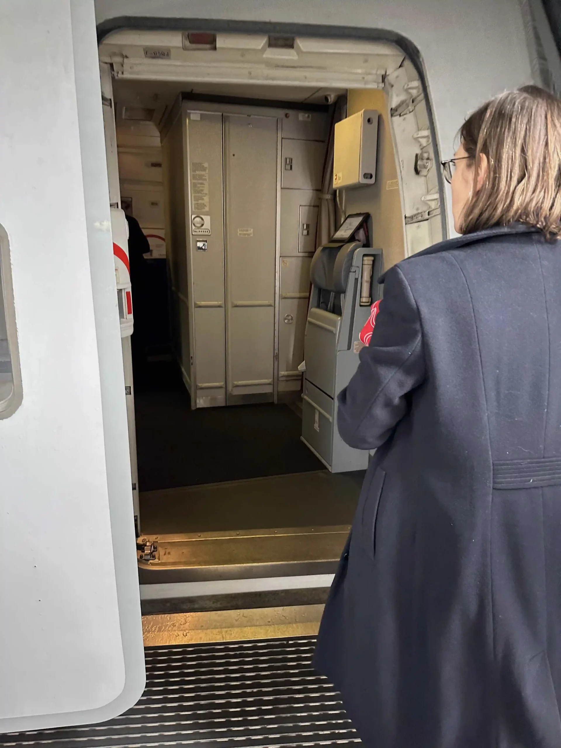 a woman standing in a plane