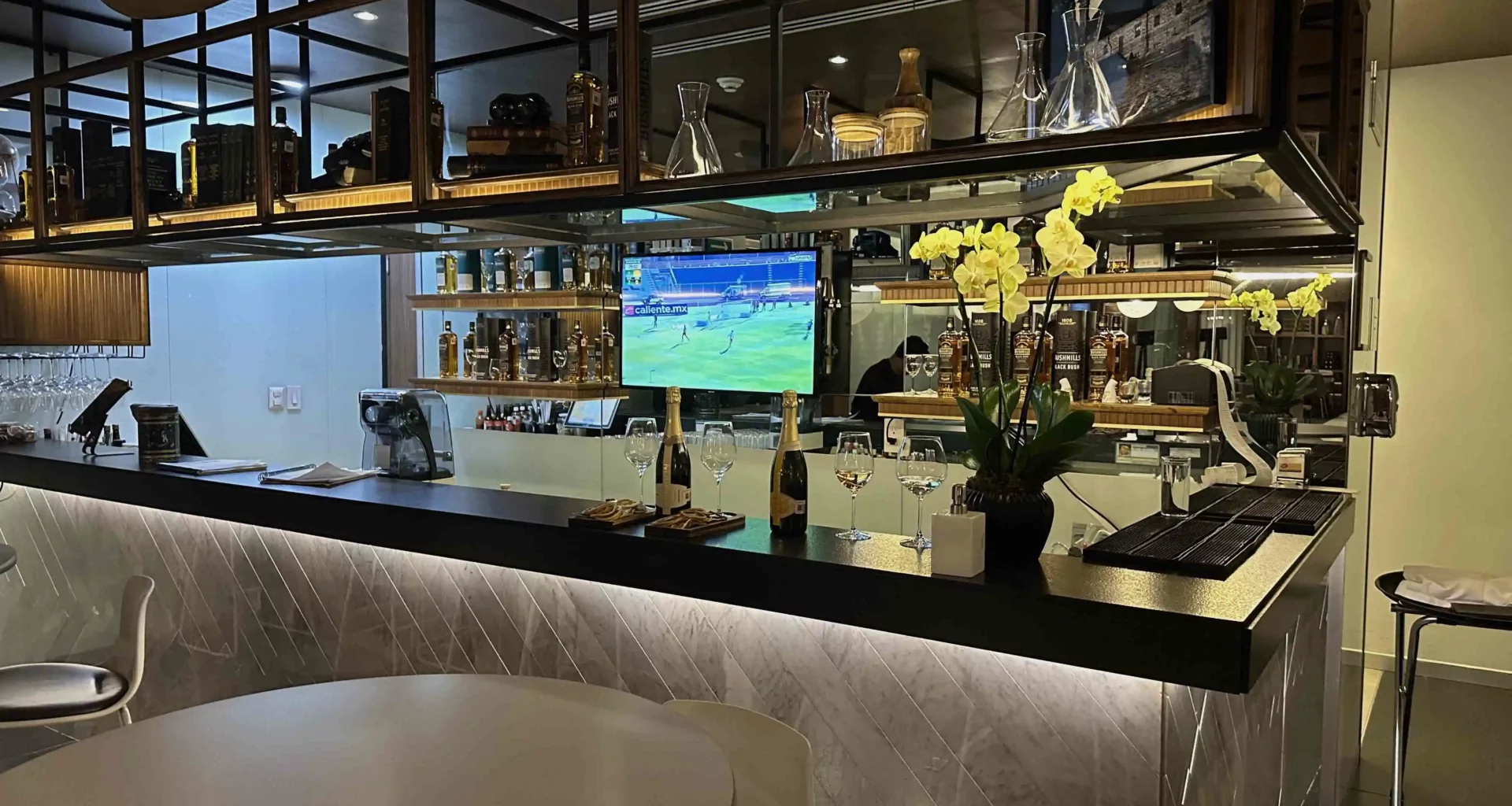 a bar with a television on the counter