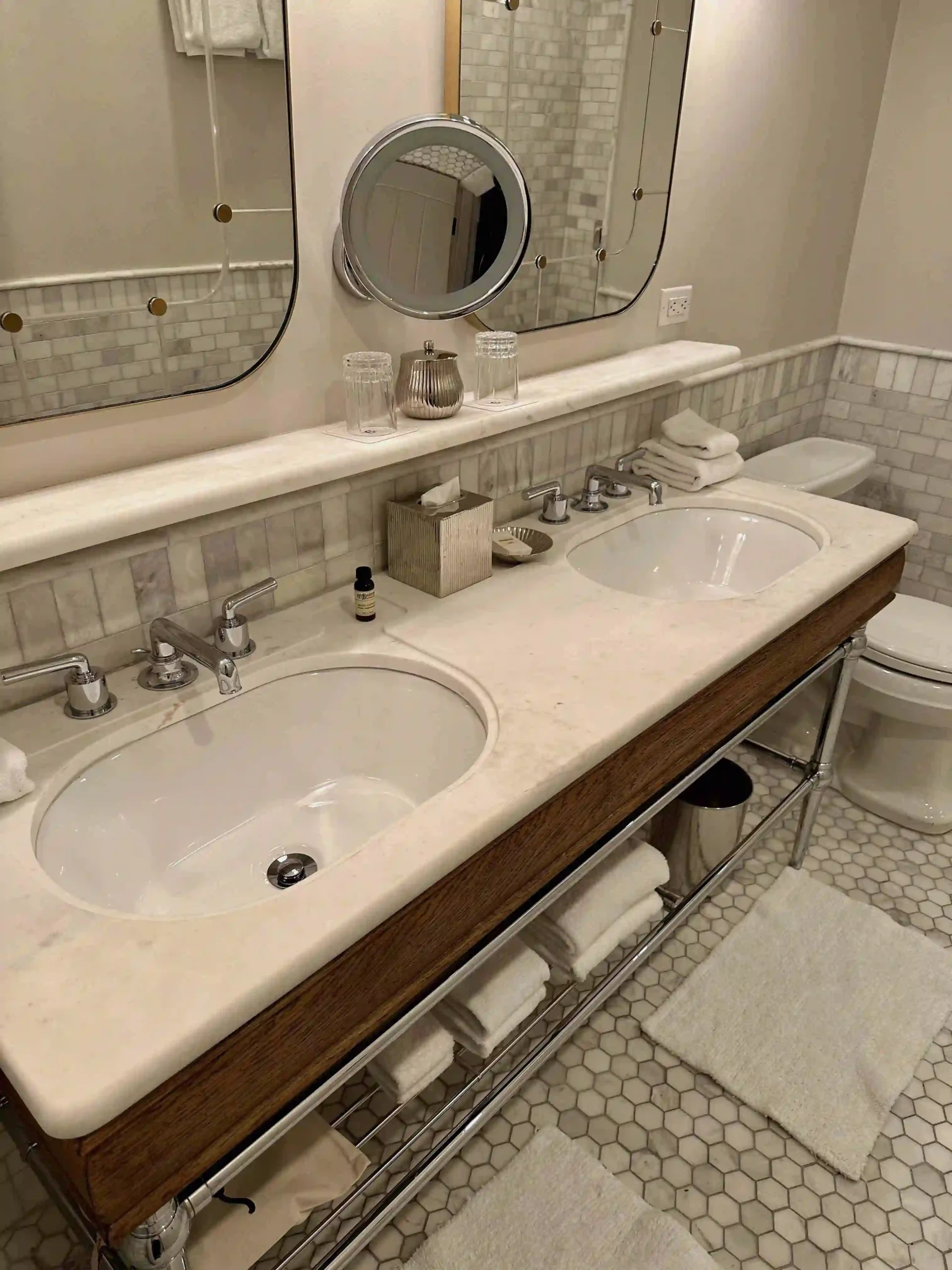 a bathroom with a large mirror and two sinks