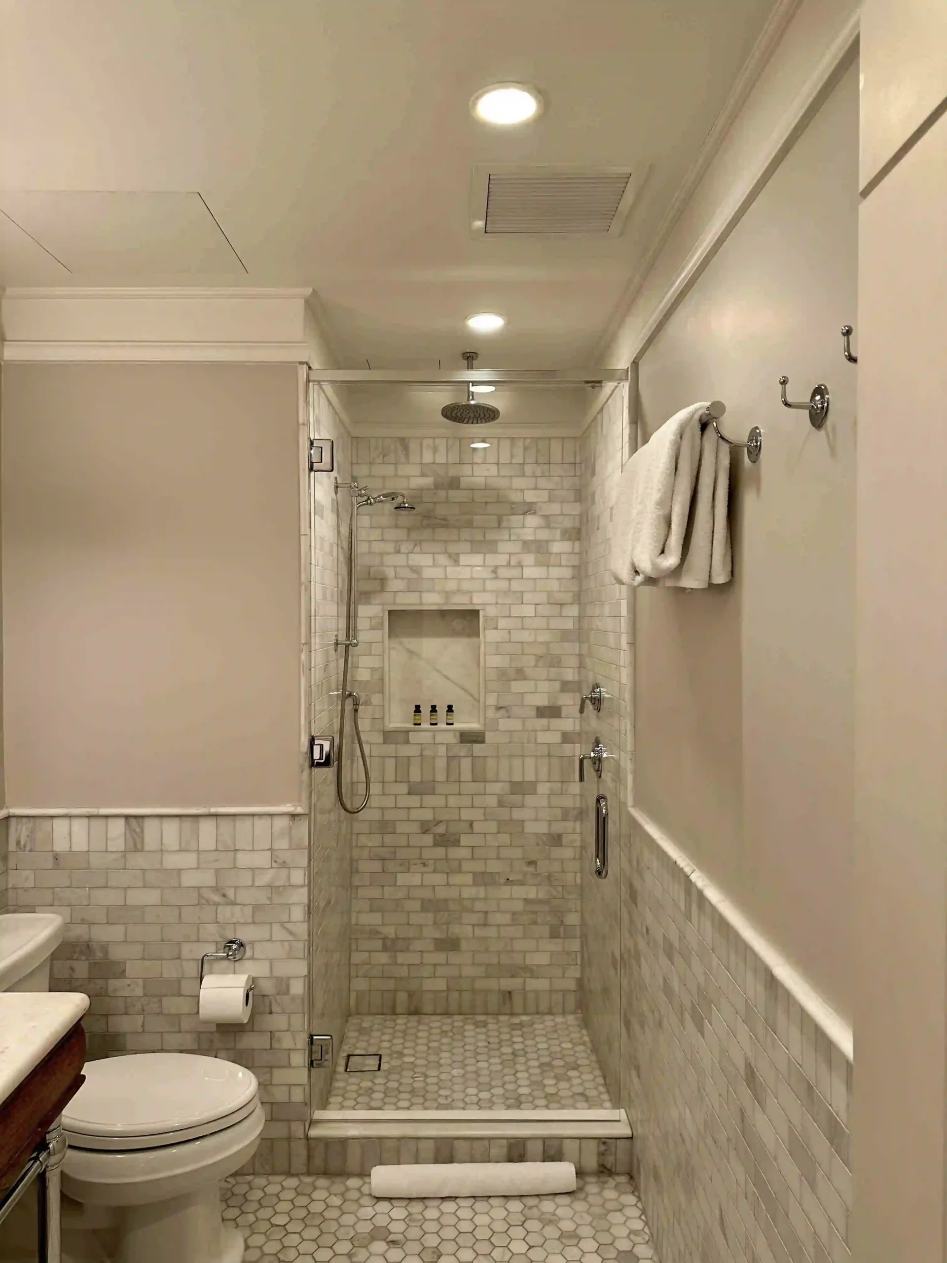 a bathroom with a shower and toilet