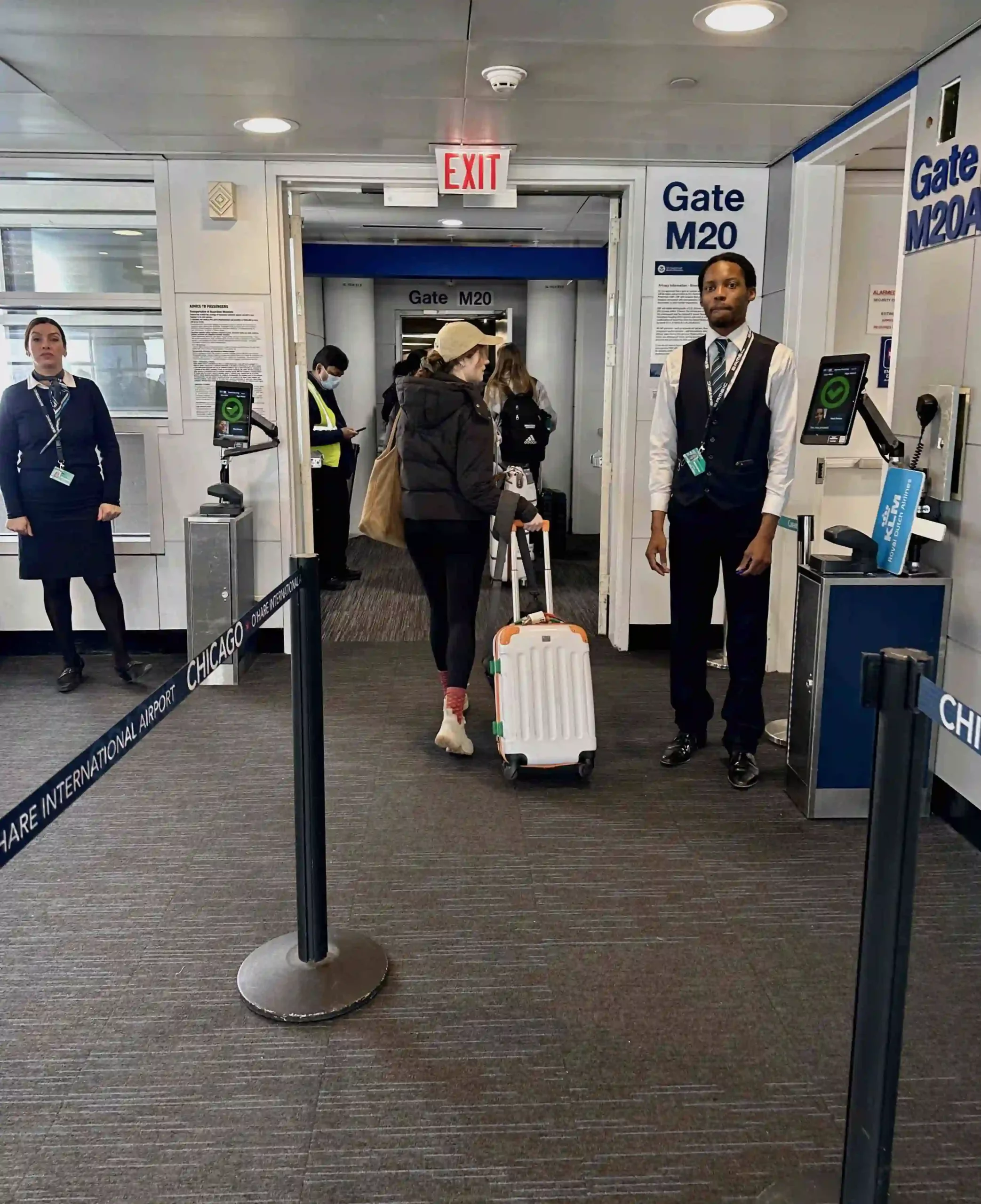 a group of people walking in an airport