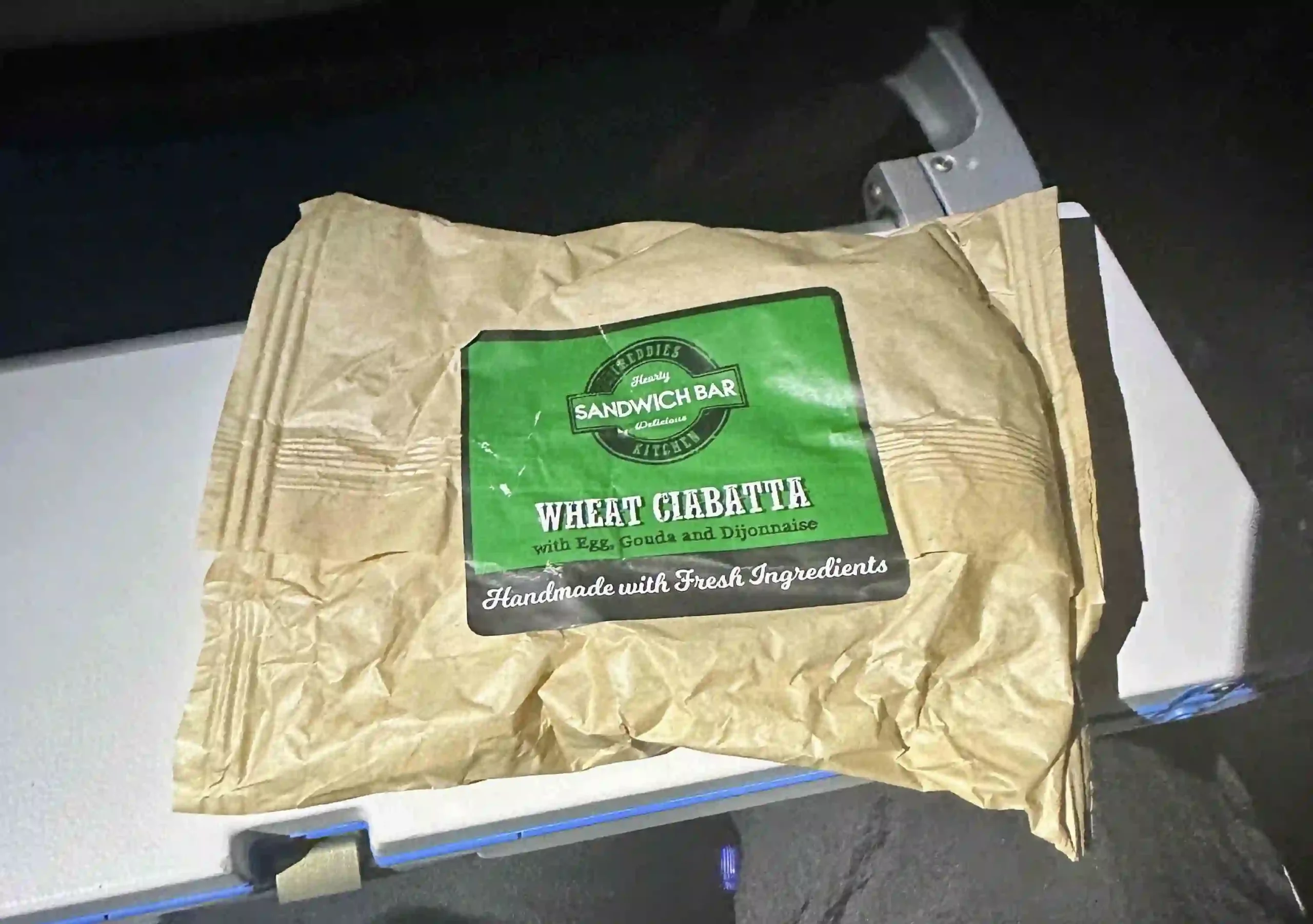 a brown bag with a green label on it