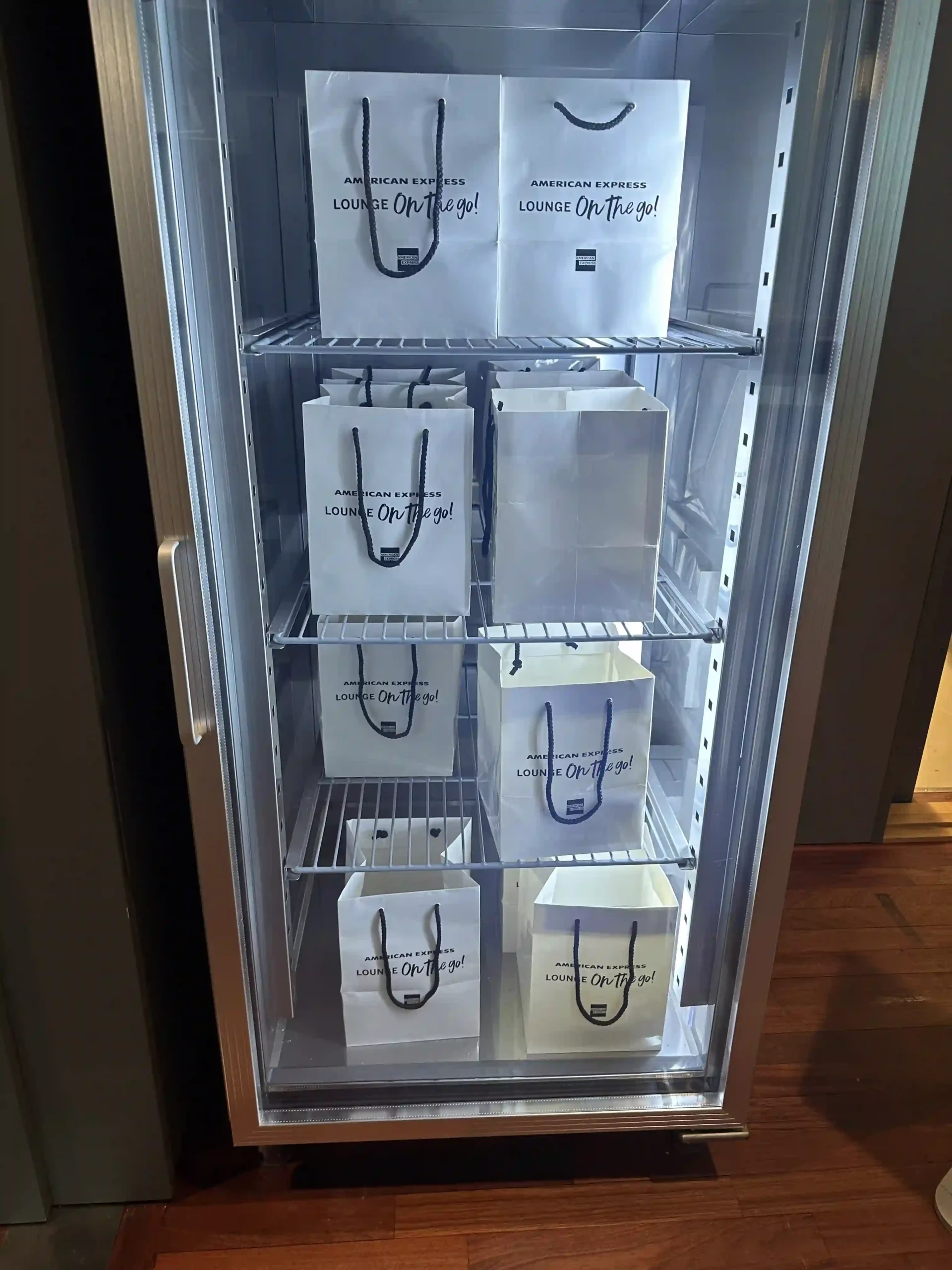 a refrigerator with white bags on it