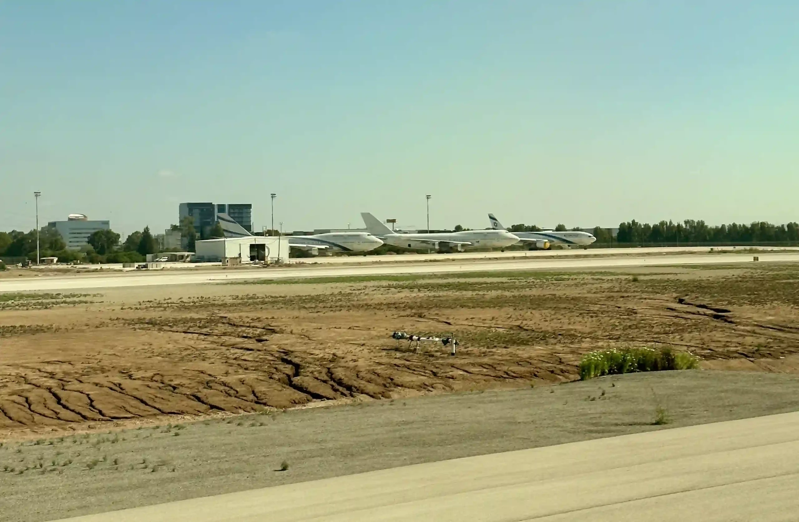 a group of airplanes on a runway