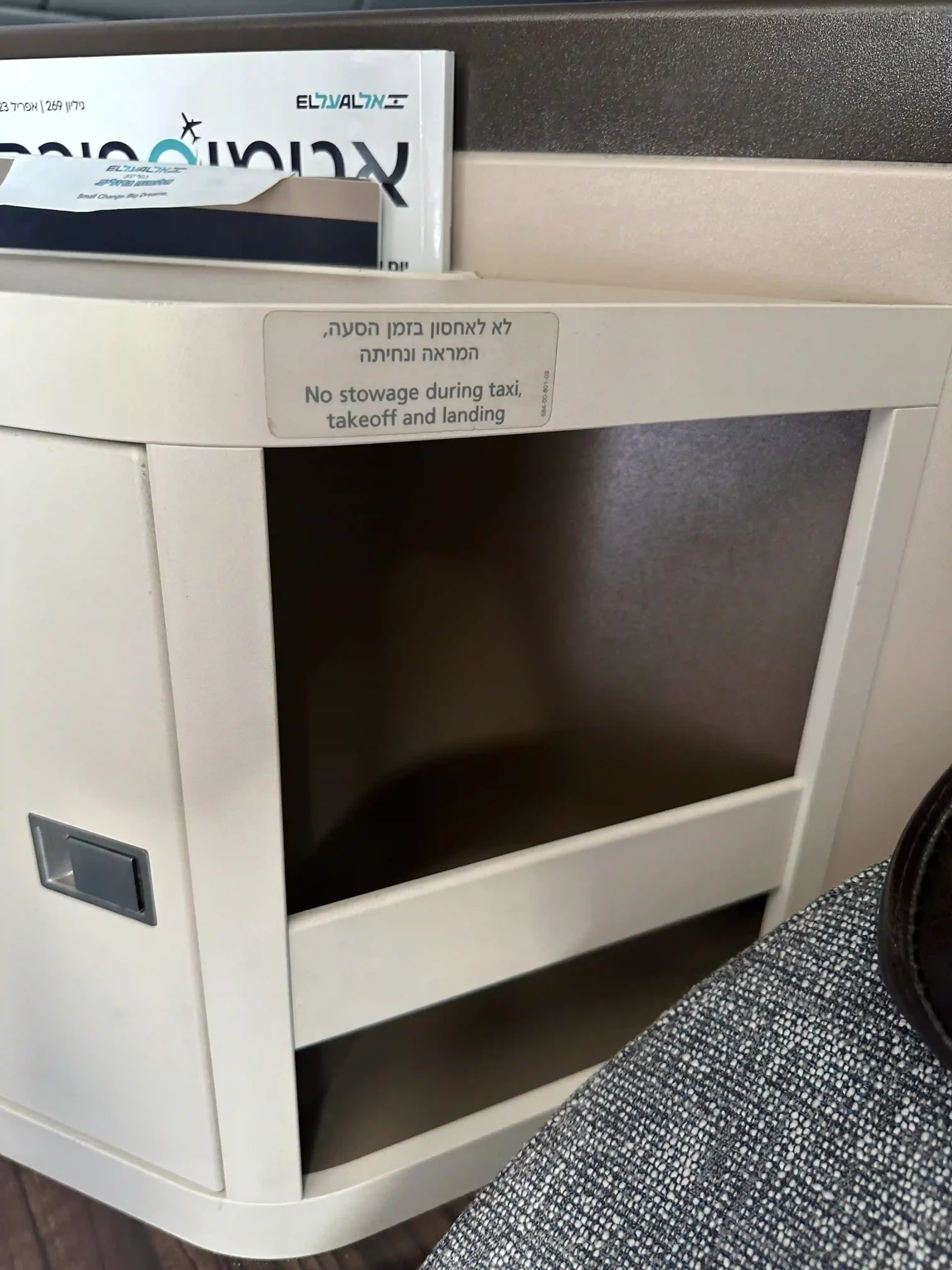 a white cabinet with a shelf