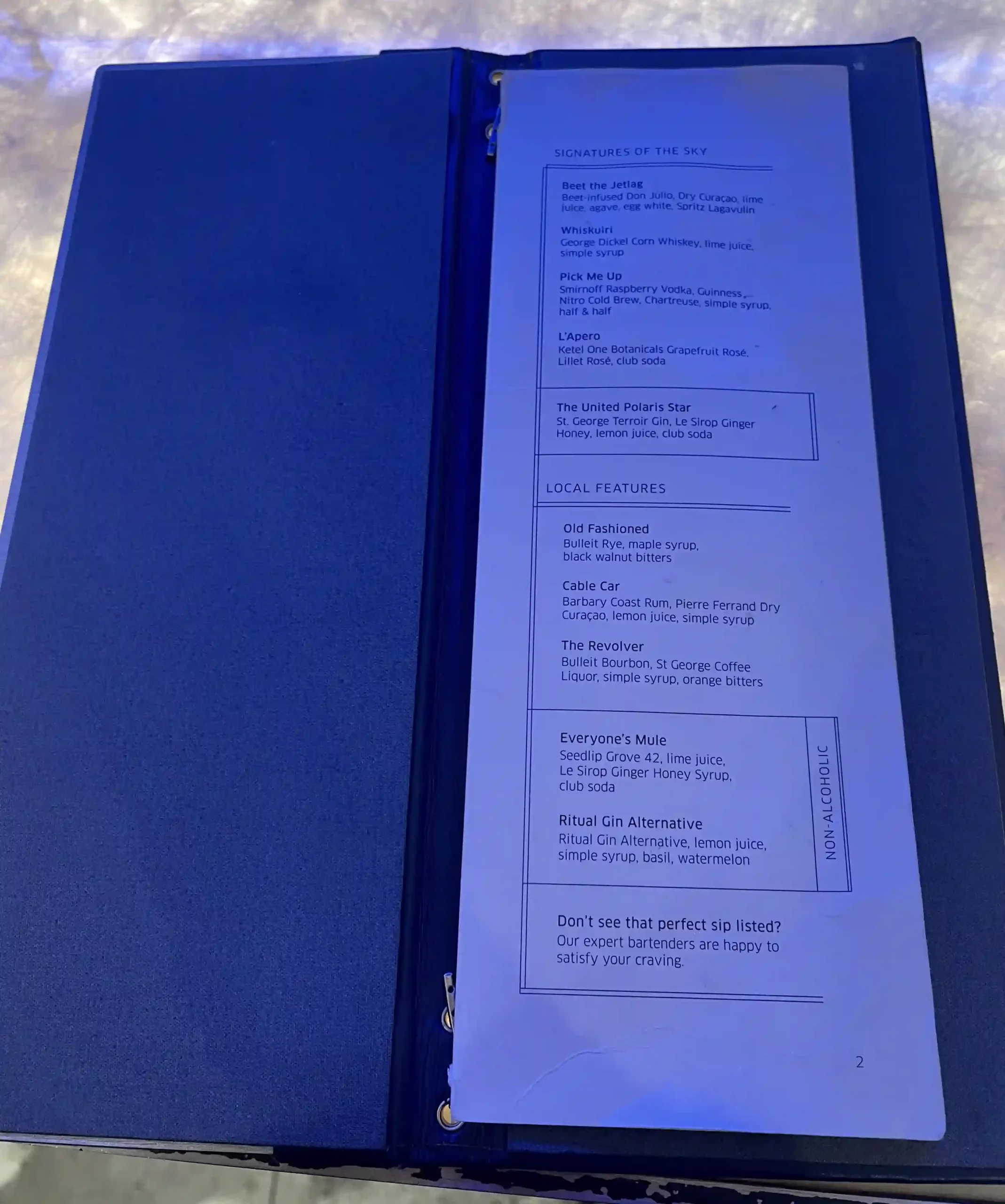 a blue folder with a piece of paper