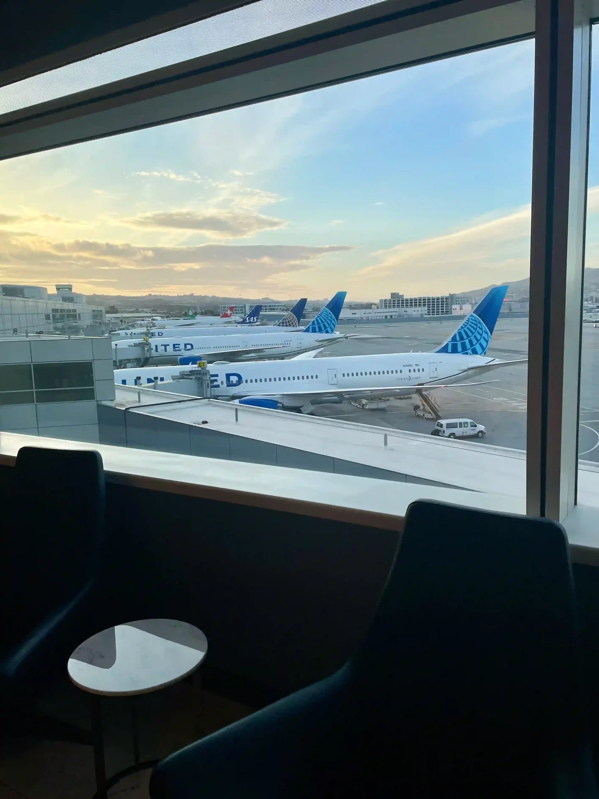 a group of airplanes at an airport