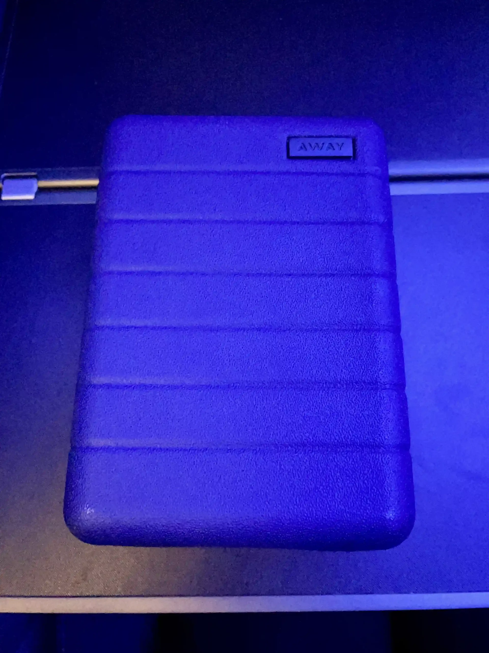 a blue plastic case on a blue surface