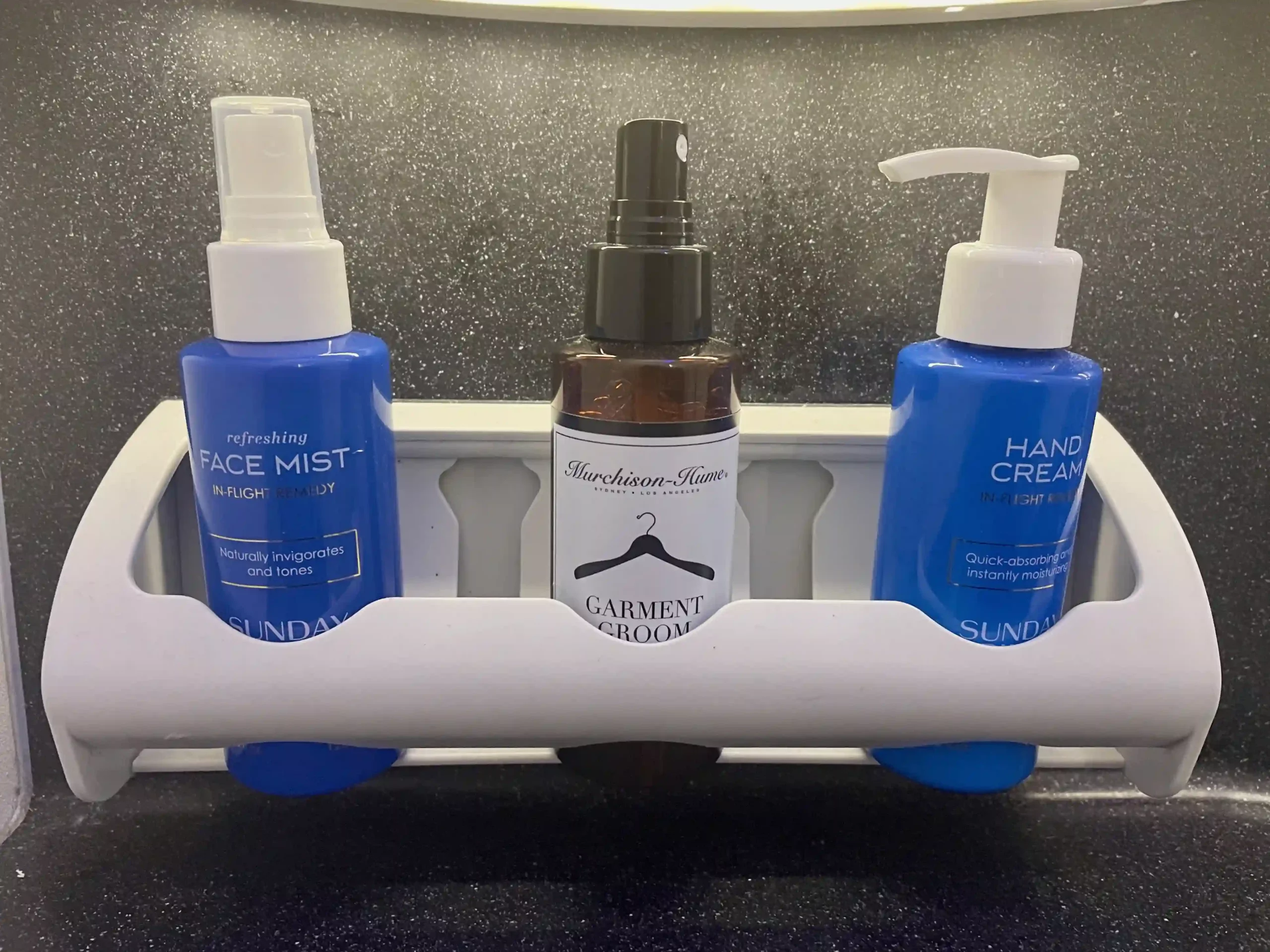 a group of bottles of hair sprays
