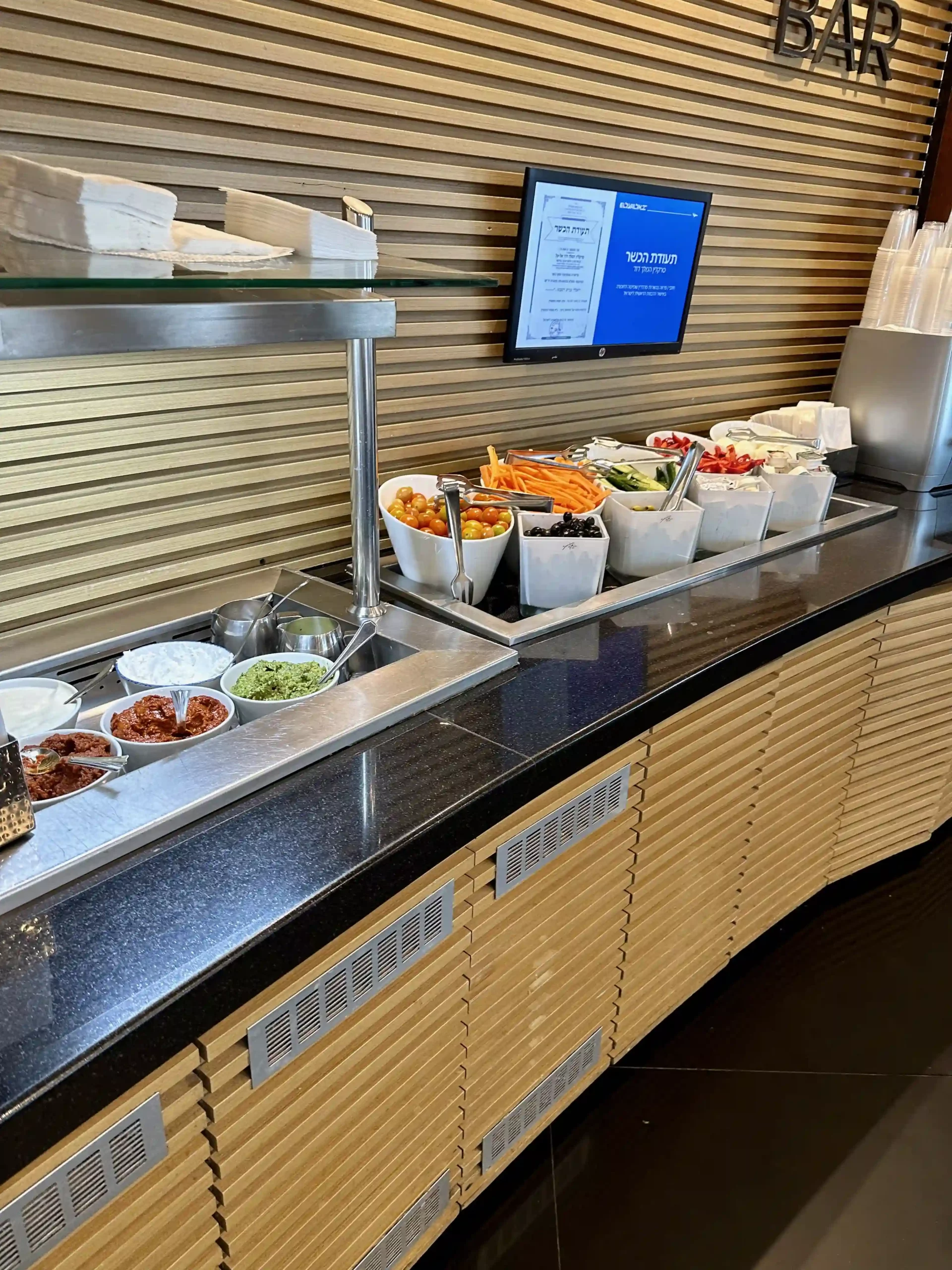 a buffet line with food in bowls
