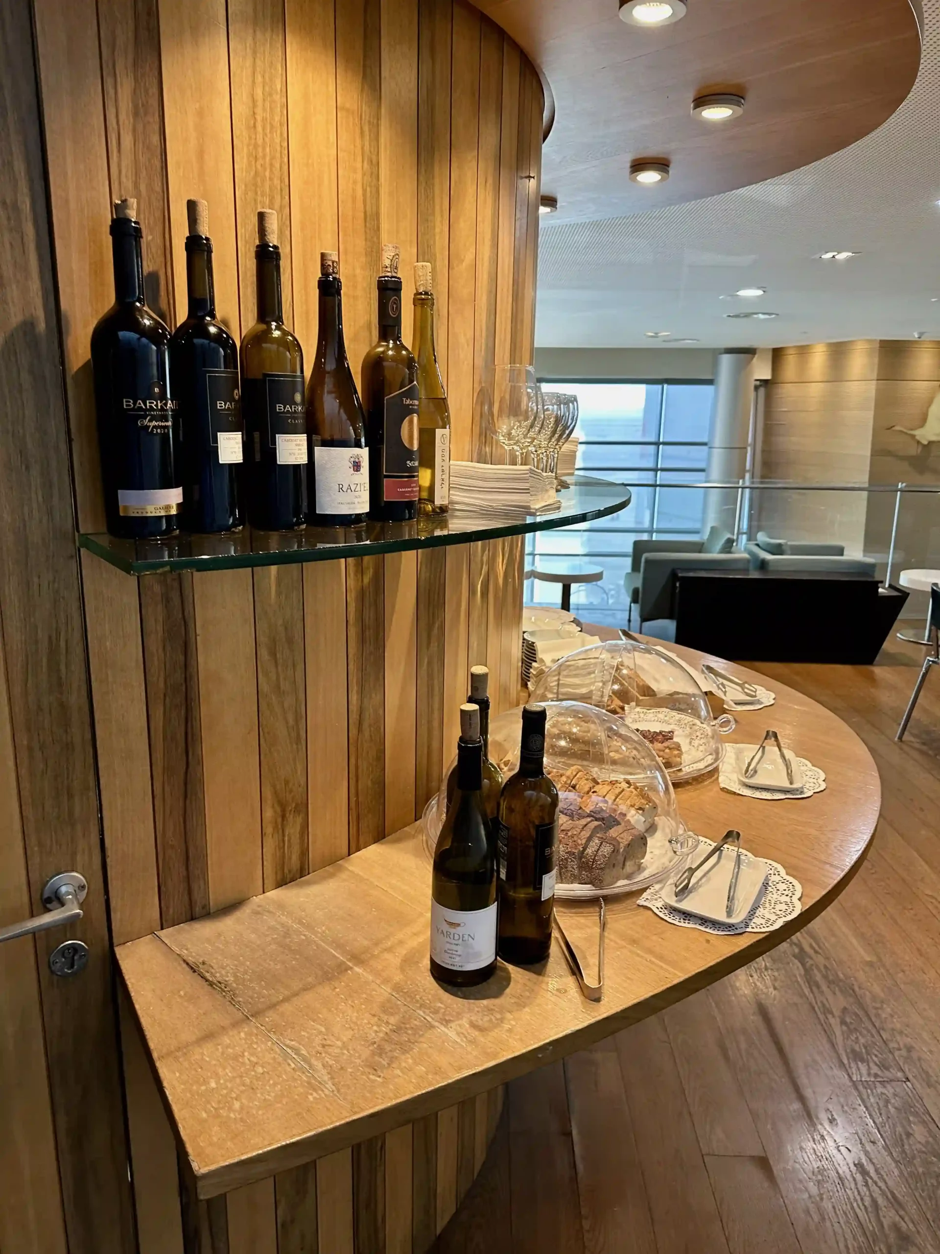 a table with wine bottles and plates on it