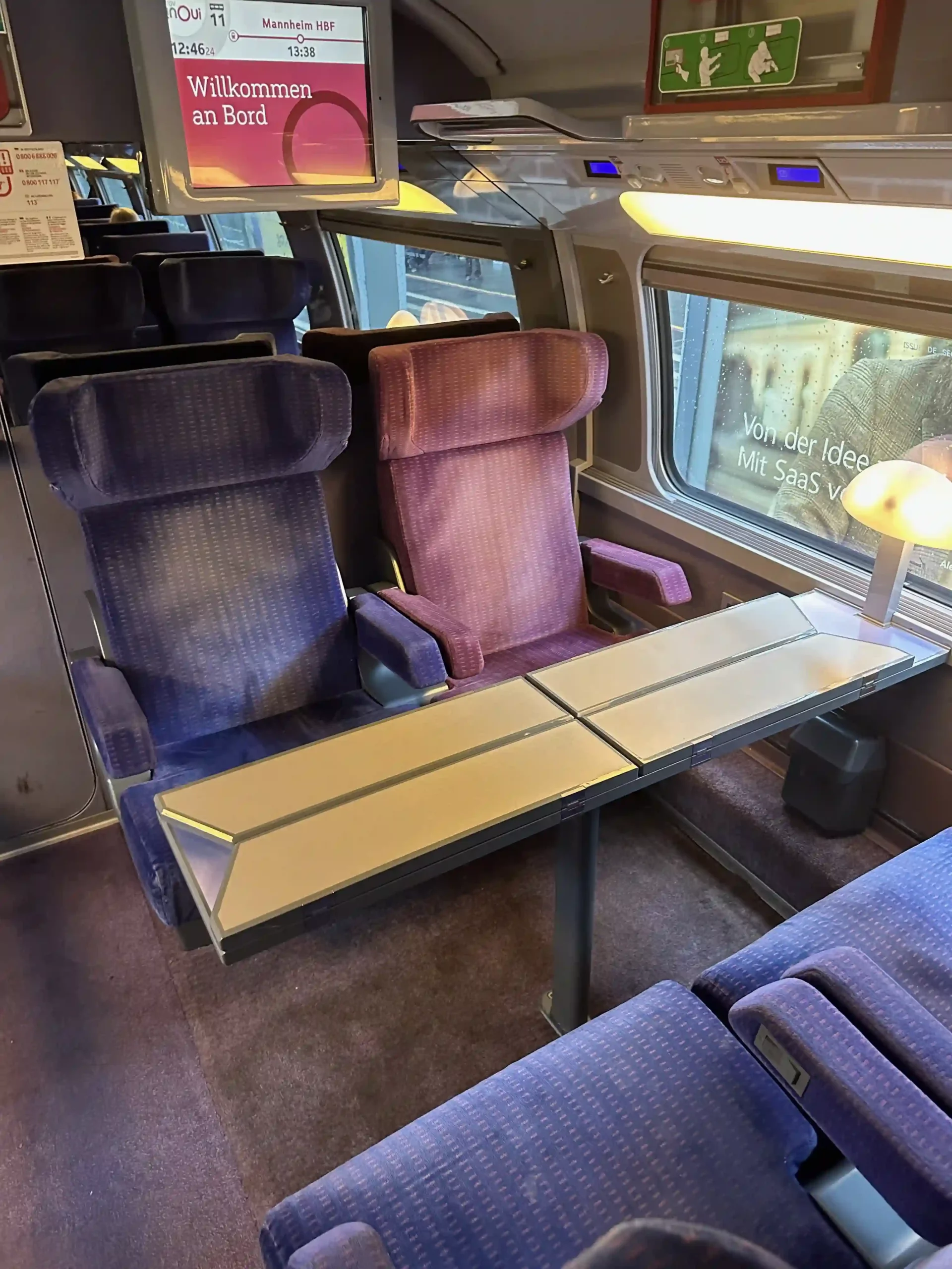 a table and chairs in a train