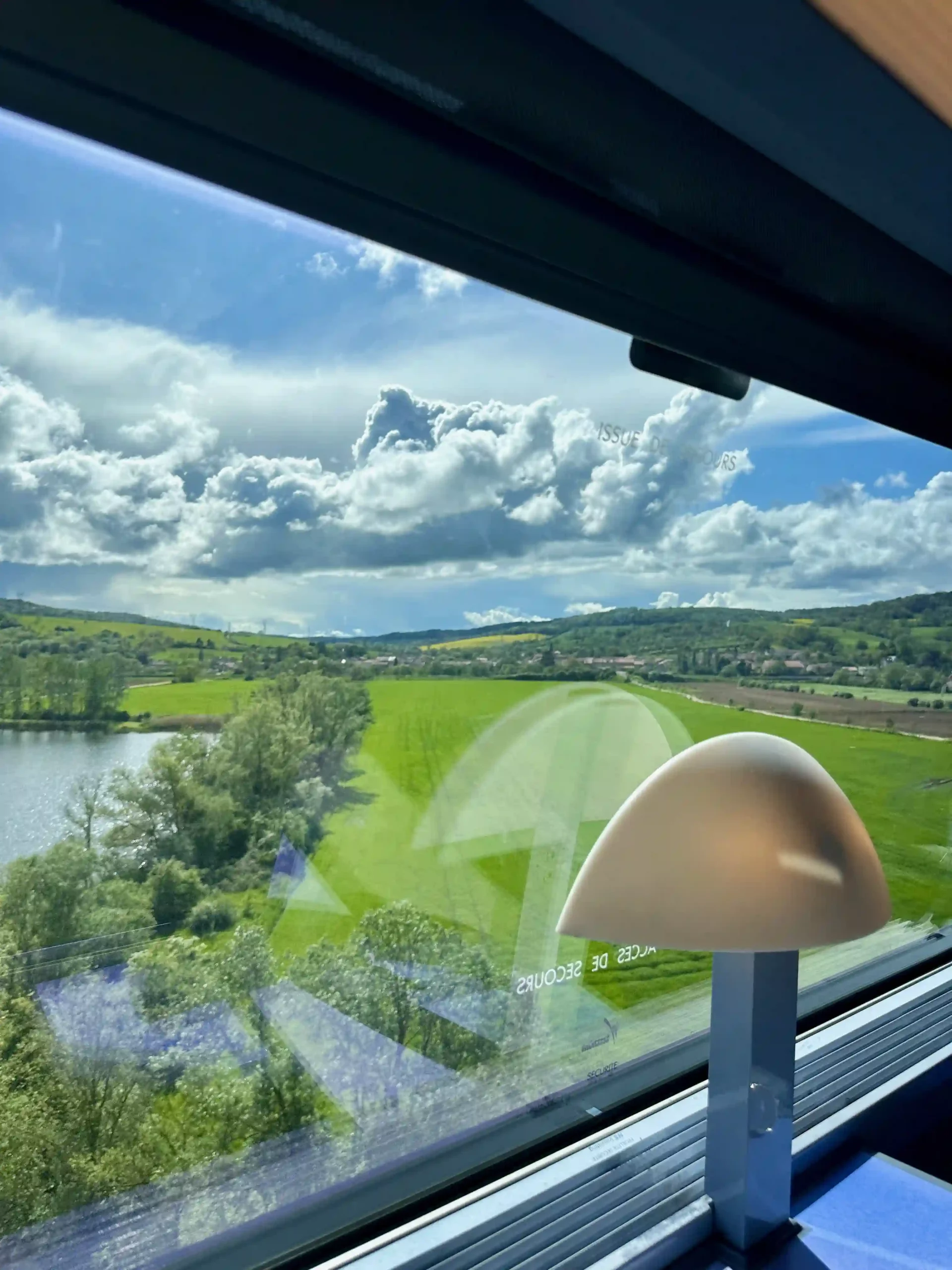 a view of a landscape from a train window