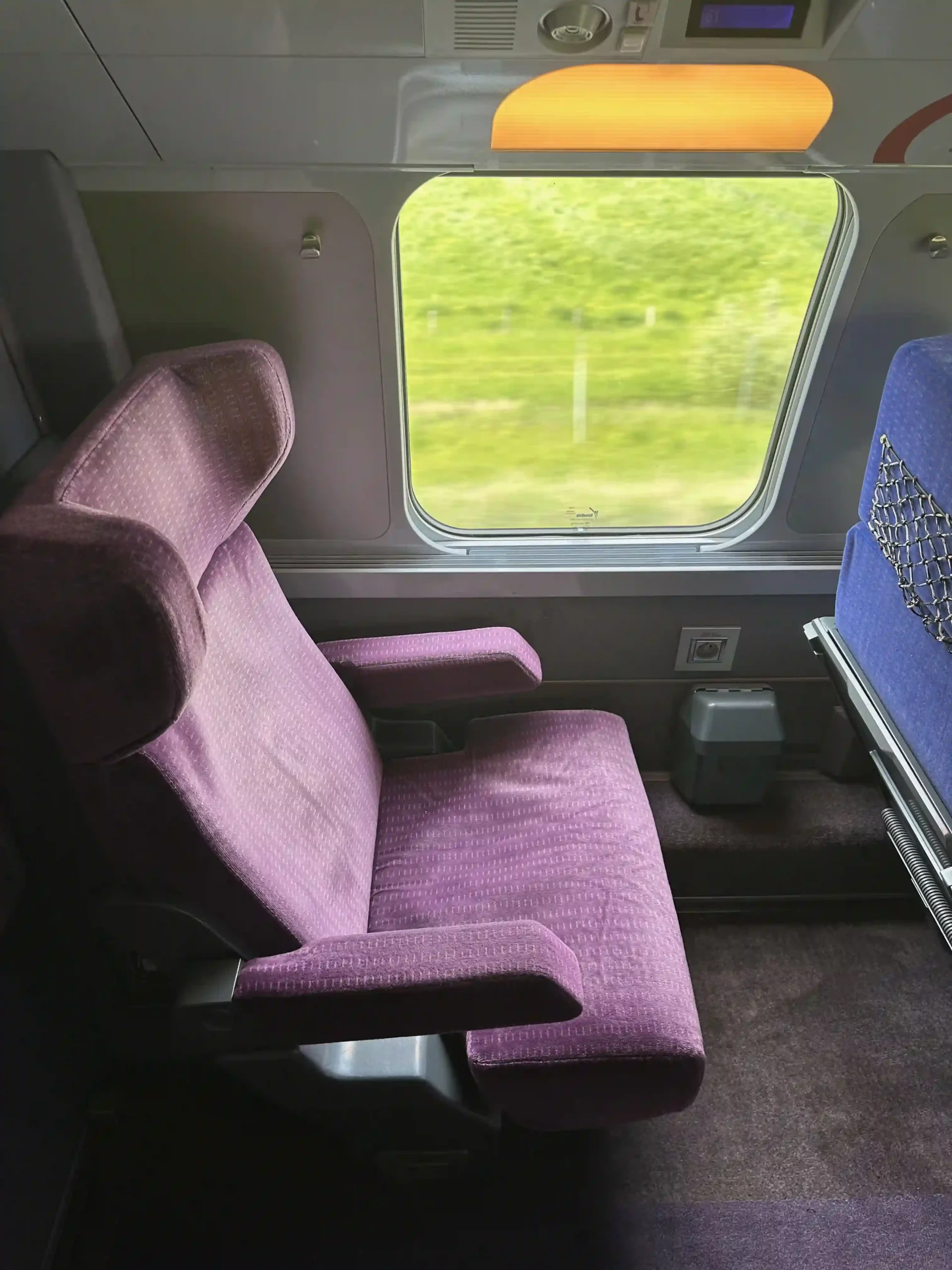 a purple seat in a train