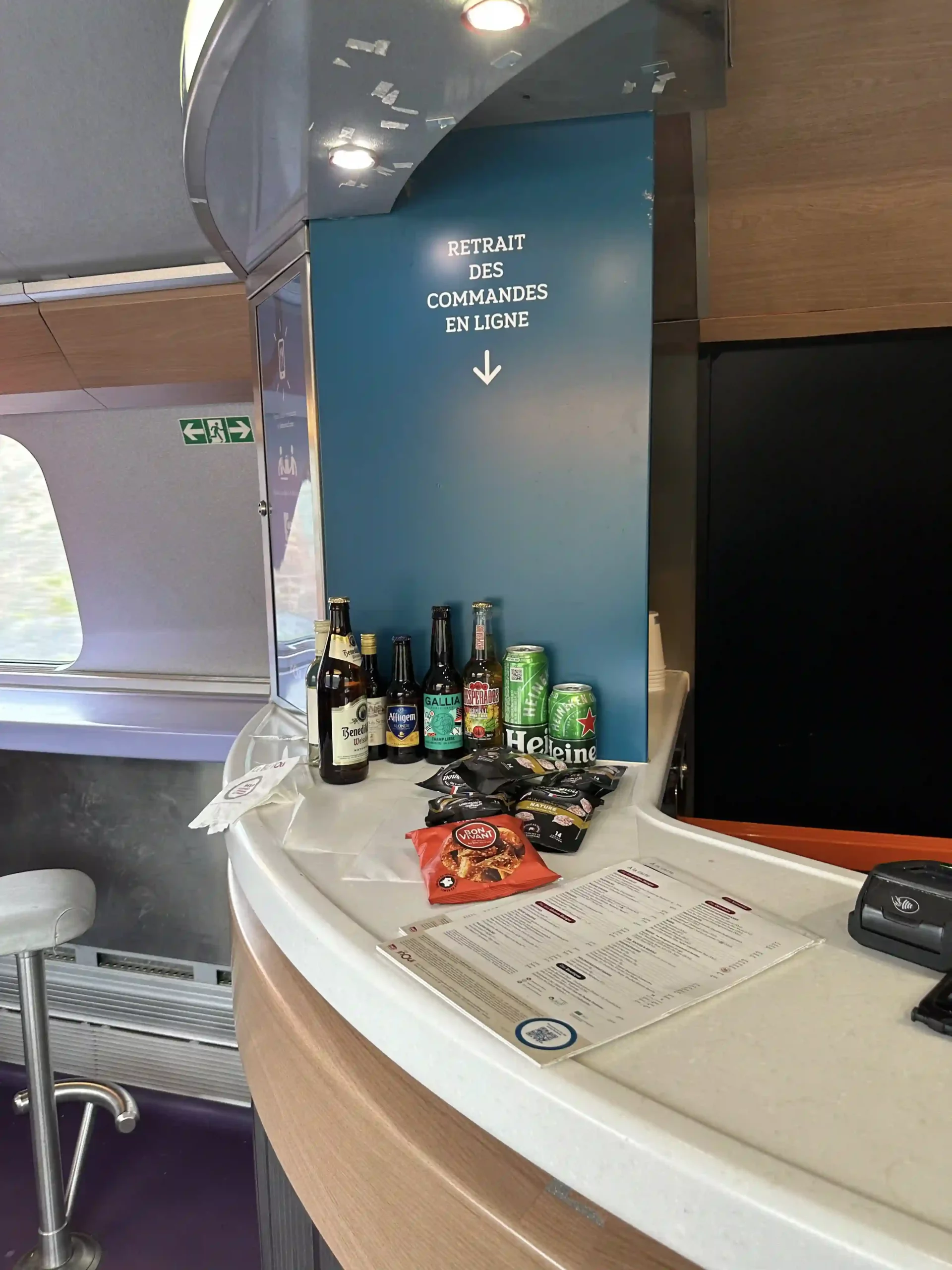 a counter with beer and snacks on it