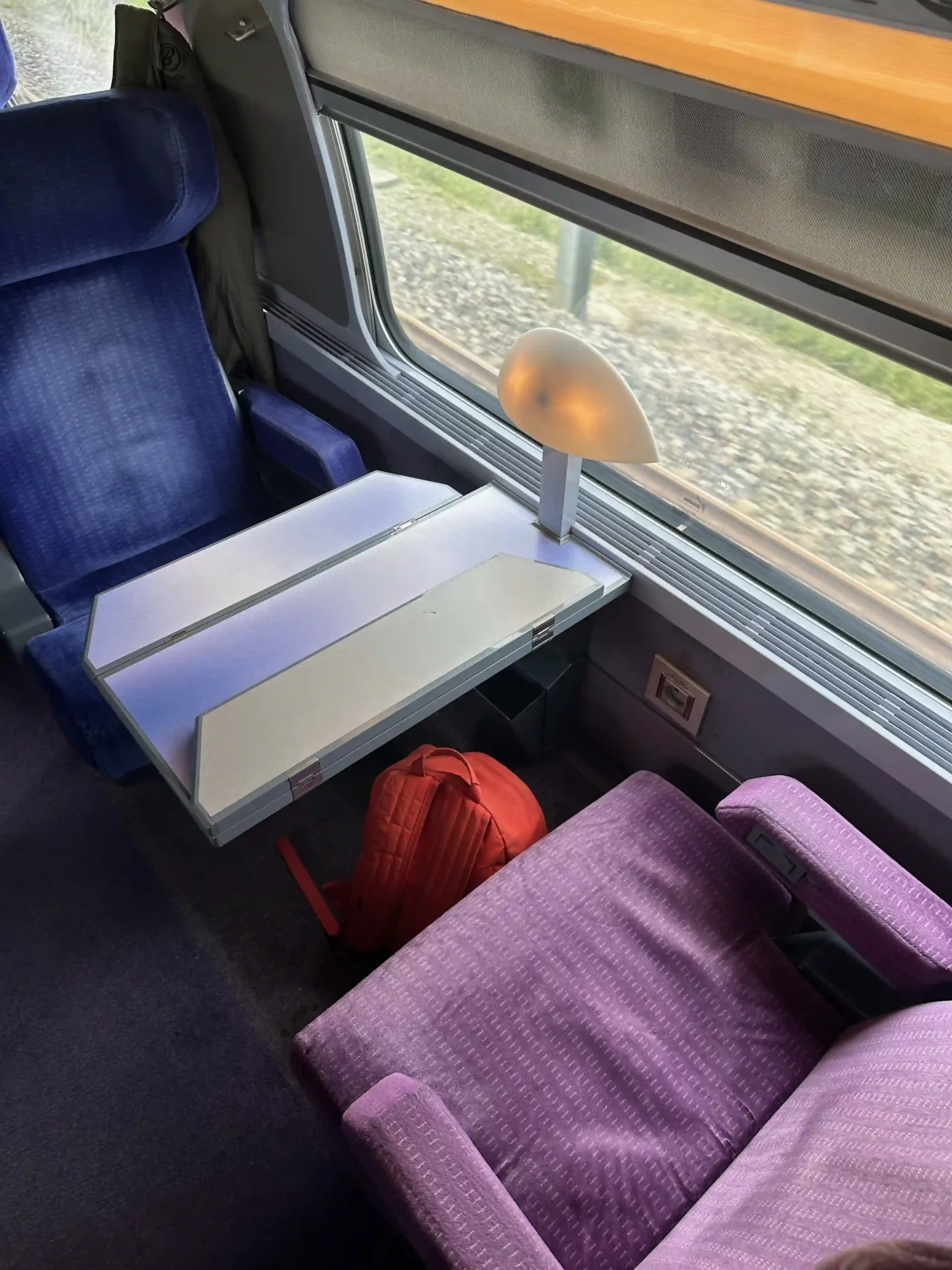 a table and chairs in a train