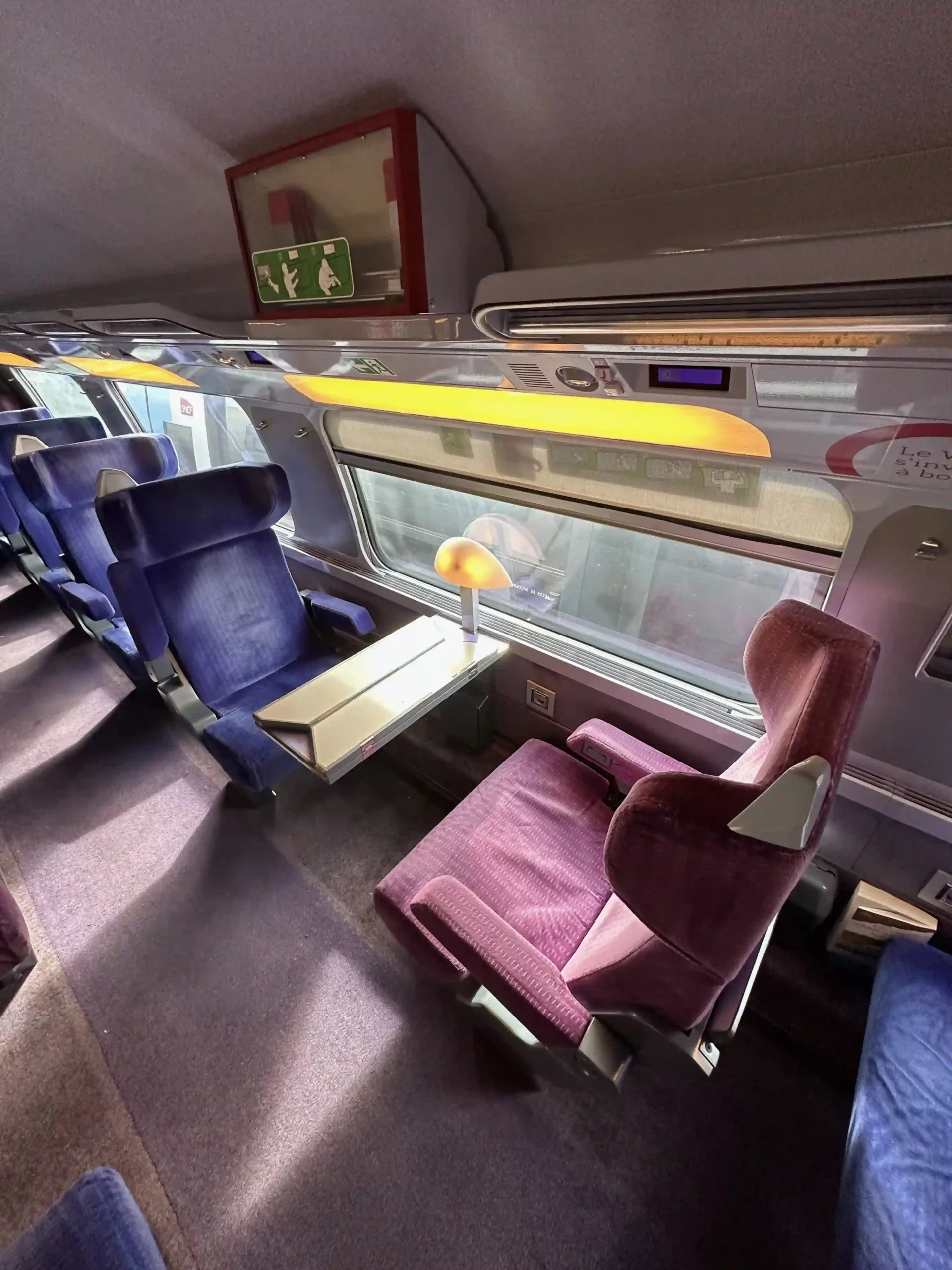 a train with seats and a table