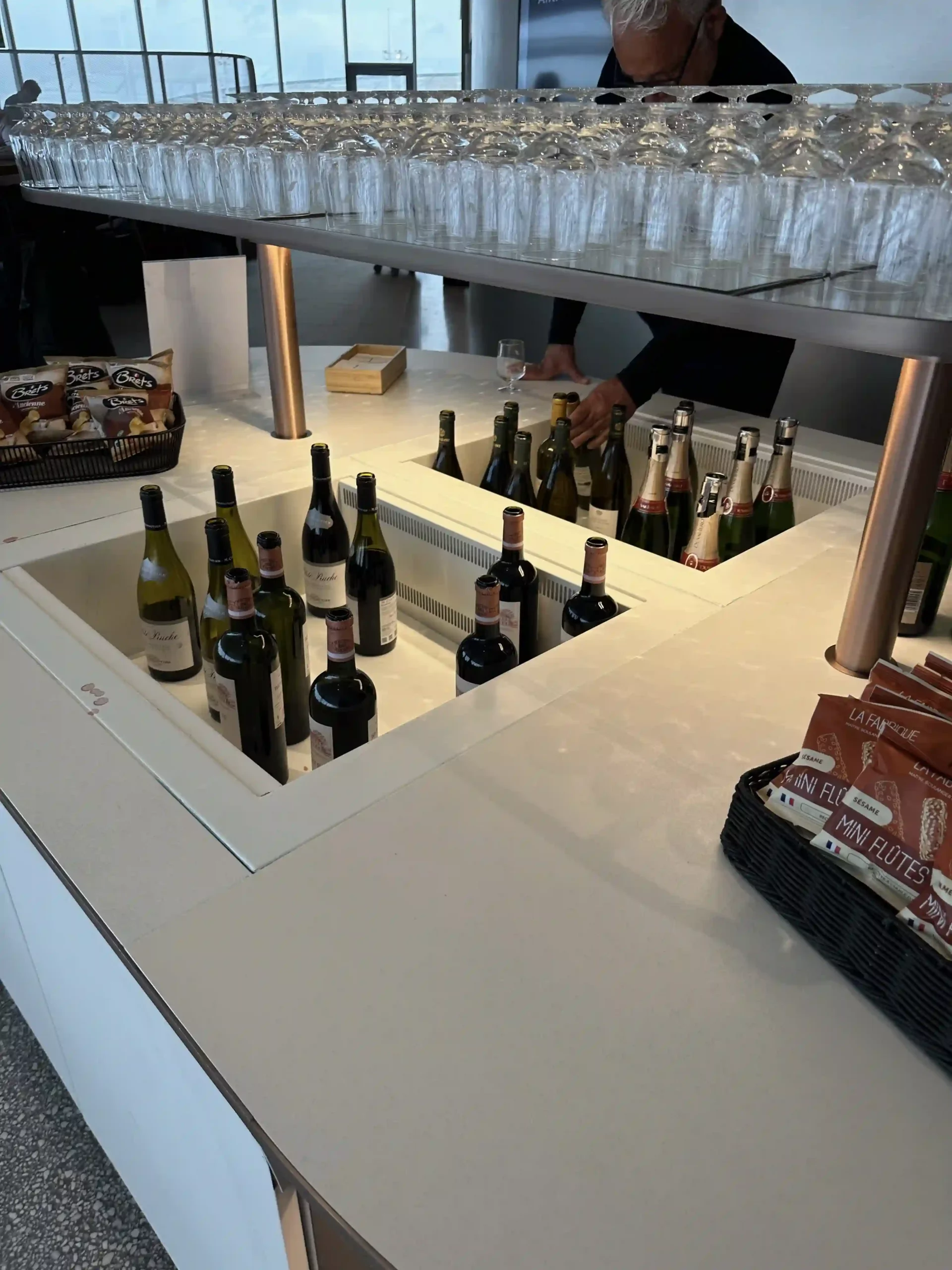 a group of wine bottles in a cooler