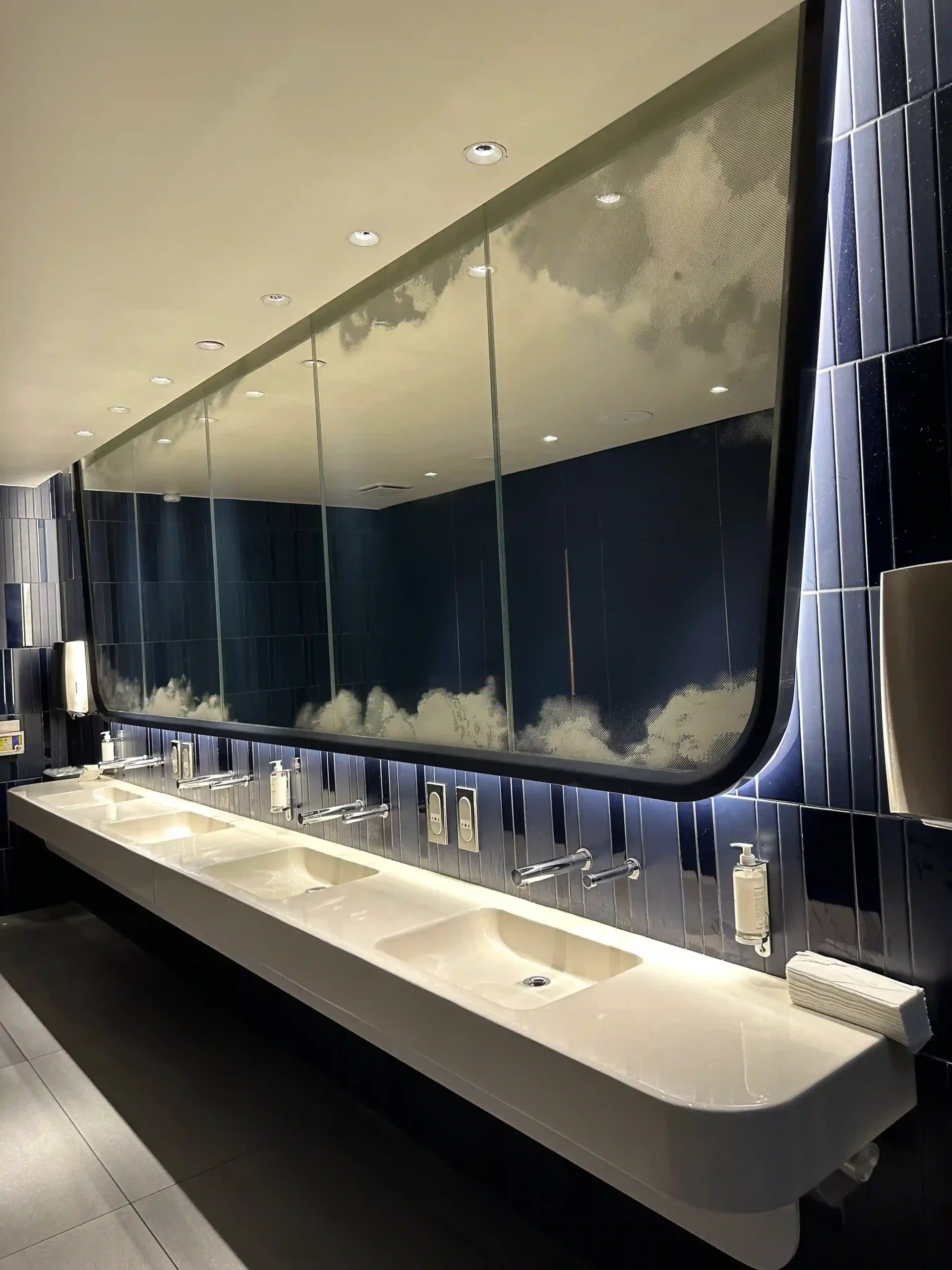 a bathroom with sinks and mirrors