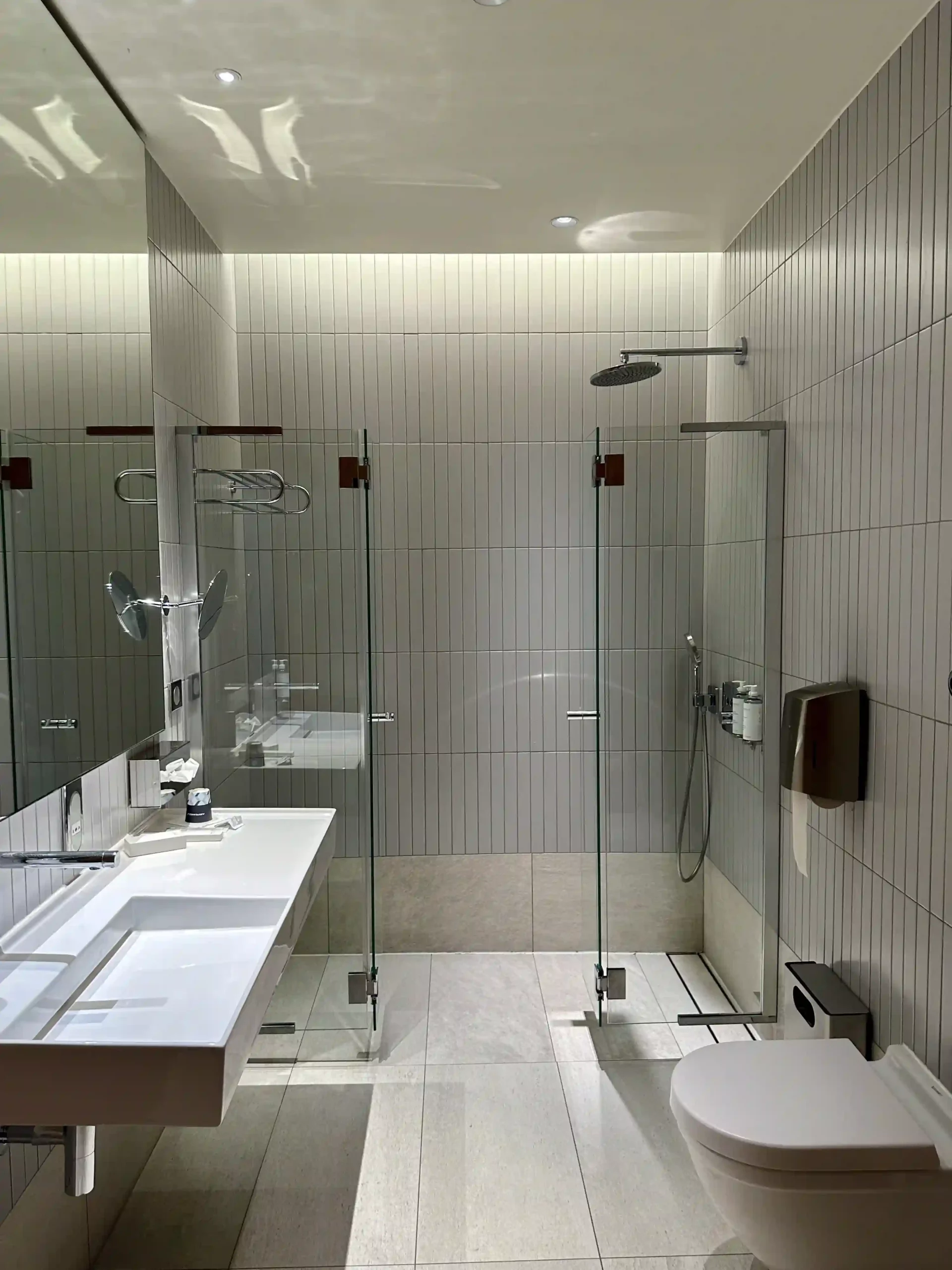 a bathroom with a shower and sink