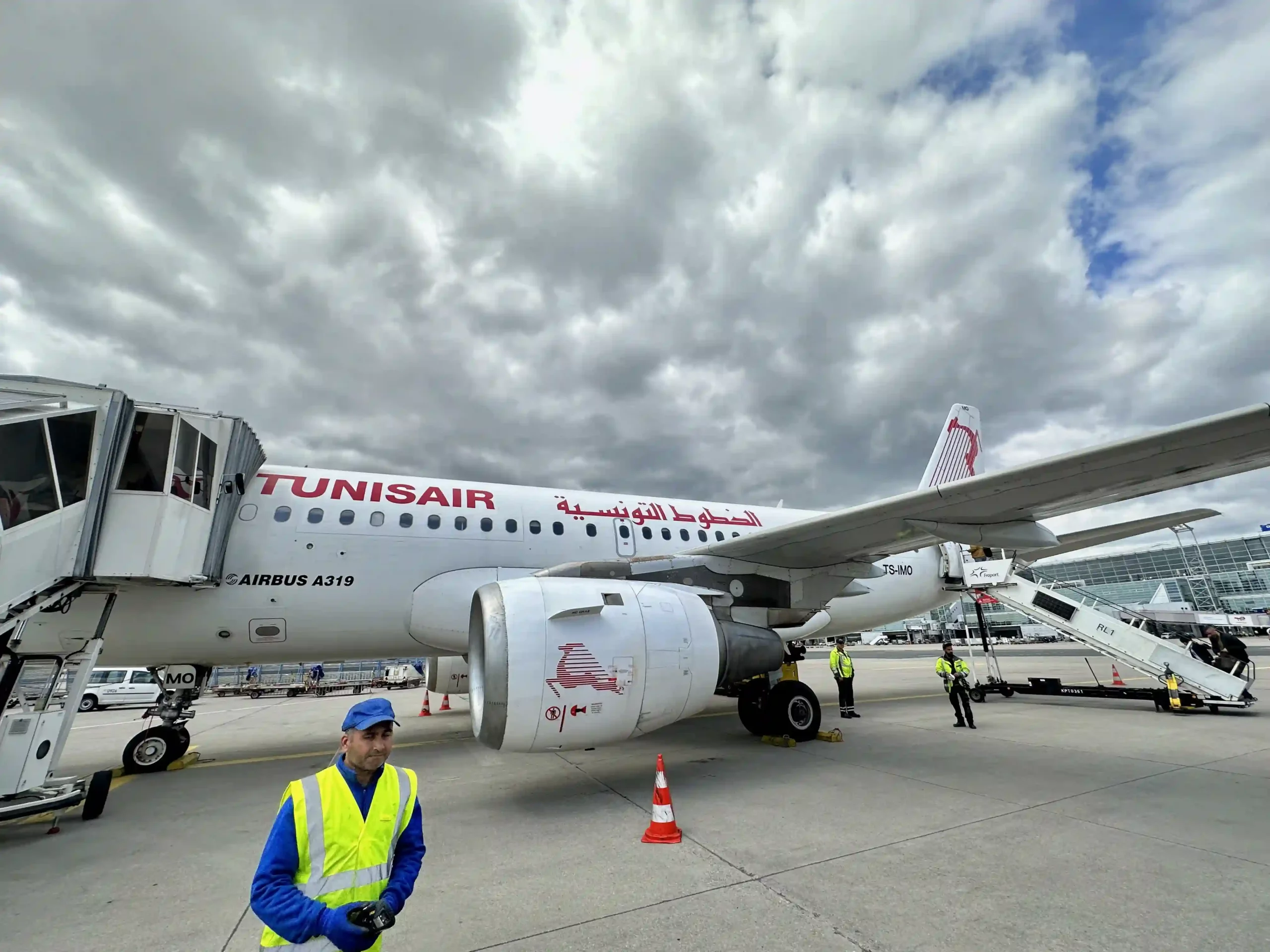 a man standing next to an airplane