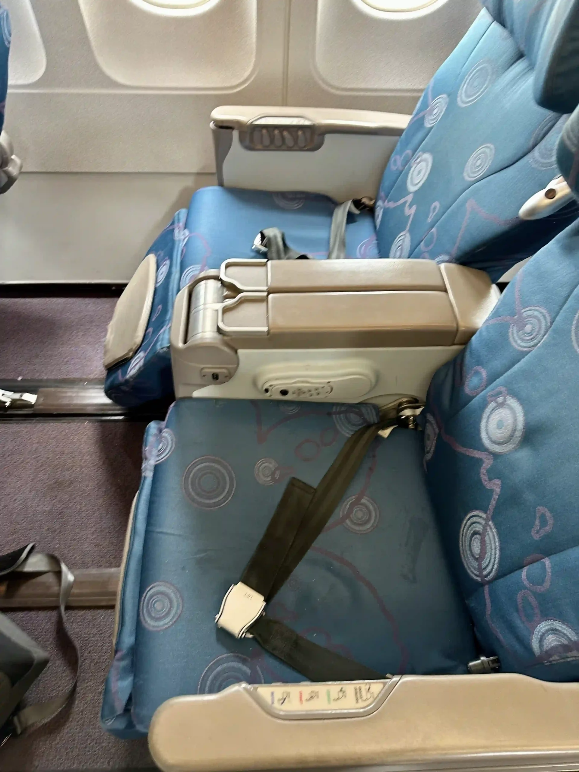 a seat belt on a plane