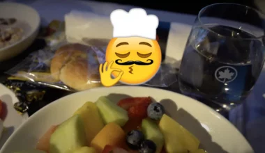 Air Canada business class breakfast with superimposed chef's kiss emoji