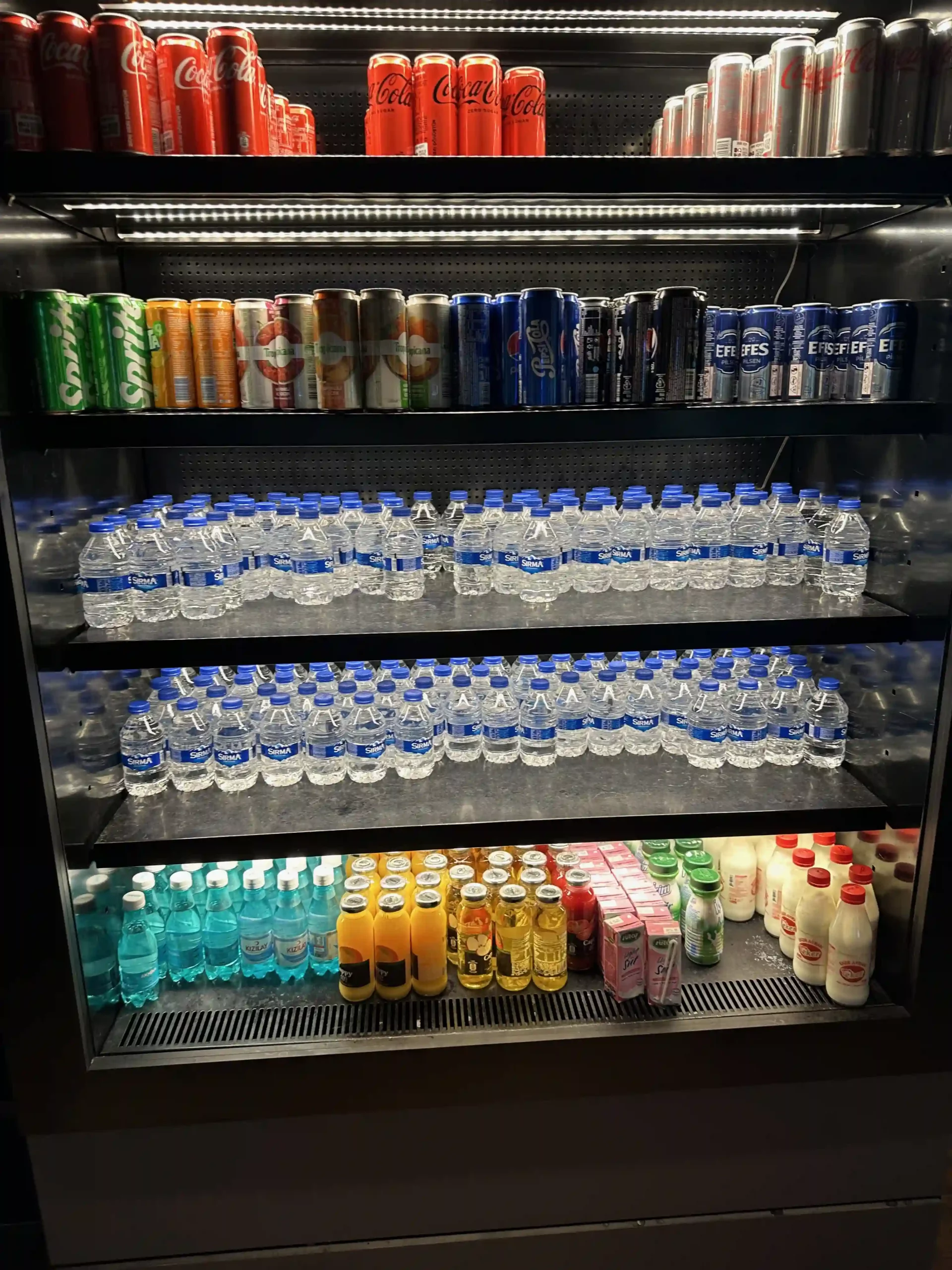 a refrigerator full of drinks and beverages